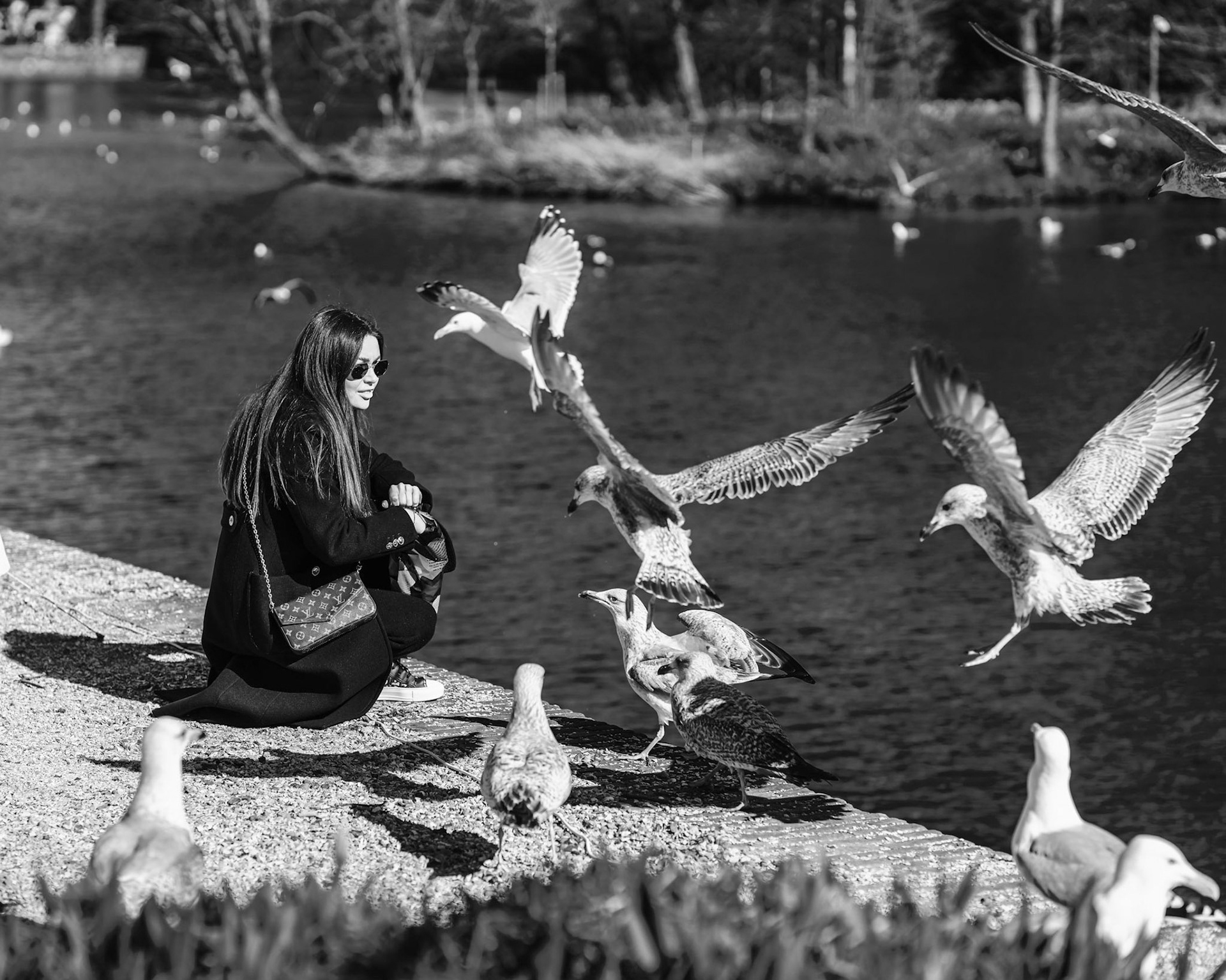 18 - Woman feeding gulls
