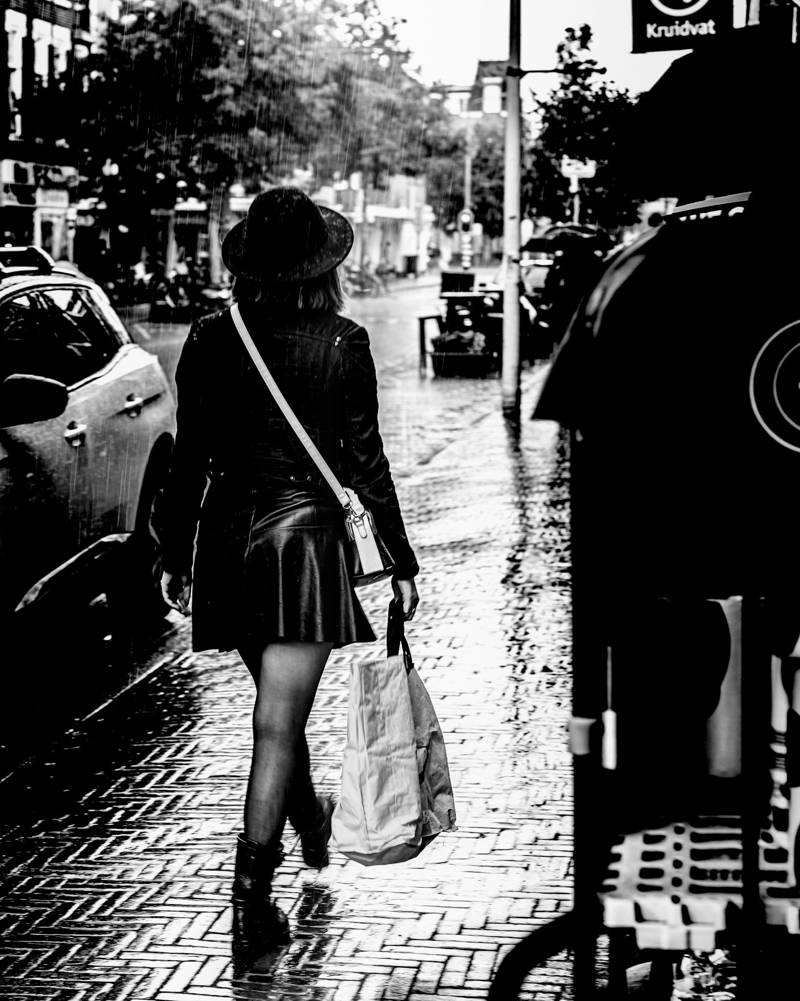 19 - woman shopping in the rain