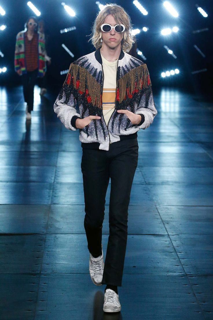 Male model wearing Saint Laurent Spring/Summer 2016 menswear by Hedi Slimane, showcasing skinny jeans and rock-inspired styling