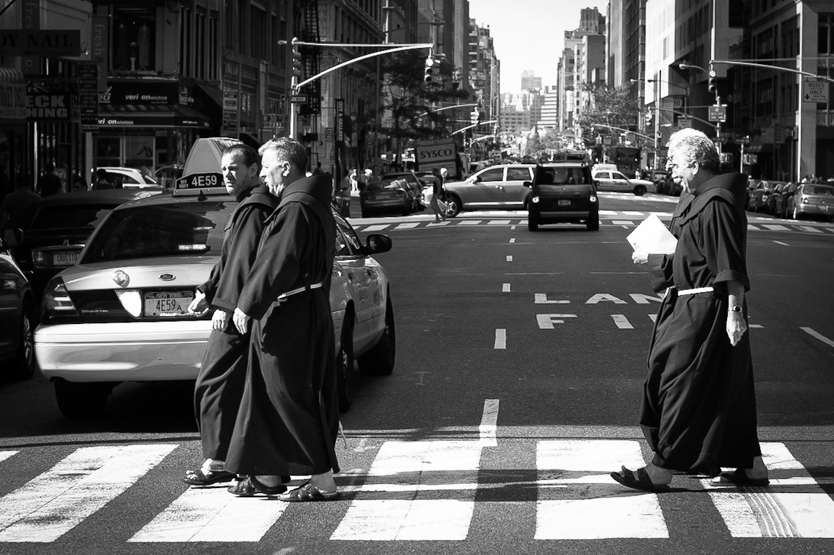A group of four months on a cross-walk in downtown Manhattan, New York