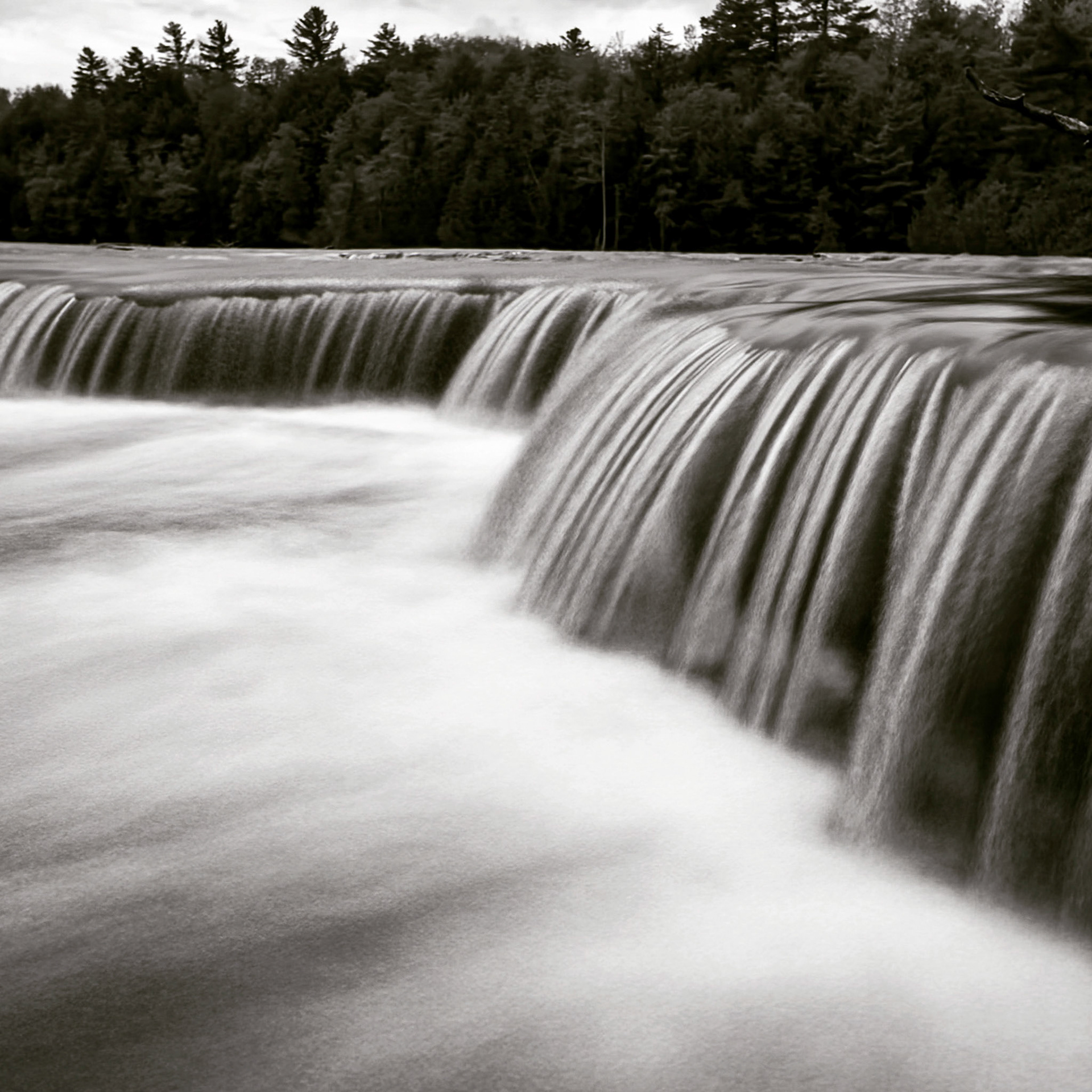 Slow motion capture of water flowing over the lower falls at Tahquamenon Falls State Park.