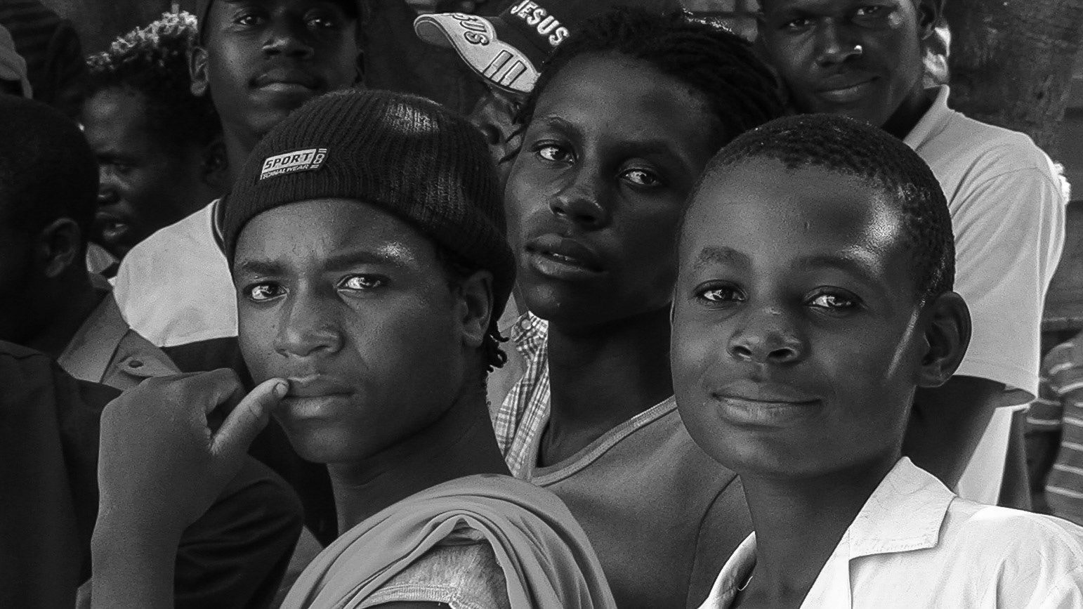 Group portrait of five Zimbabwean refugee youths.