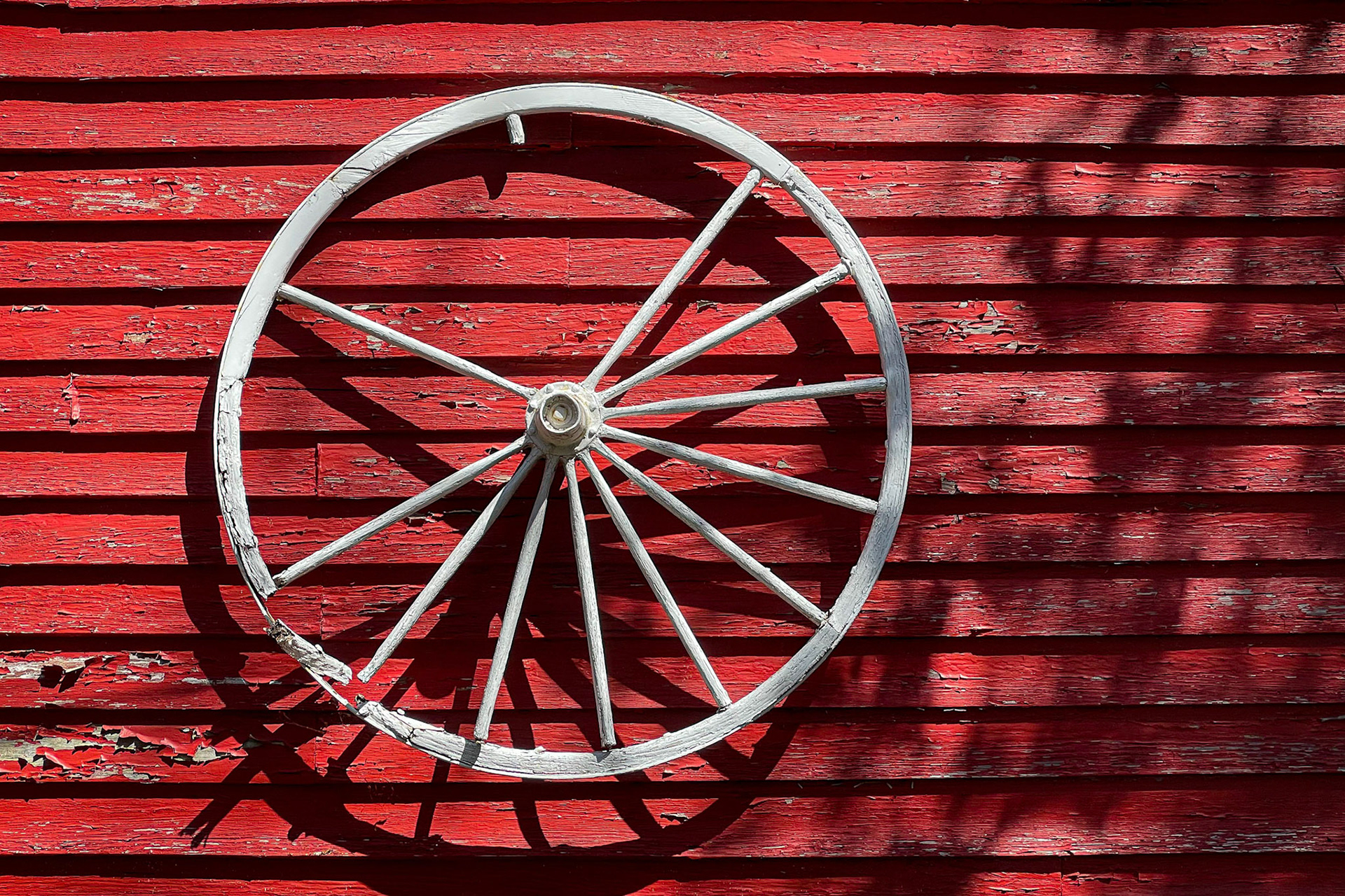 Wagon wheel mounted on wall of store in Saugatuck, MI.