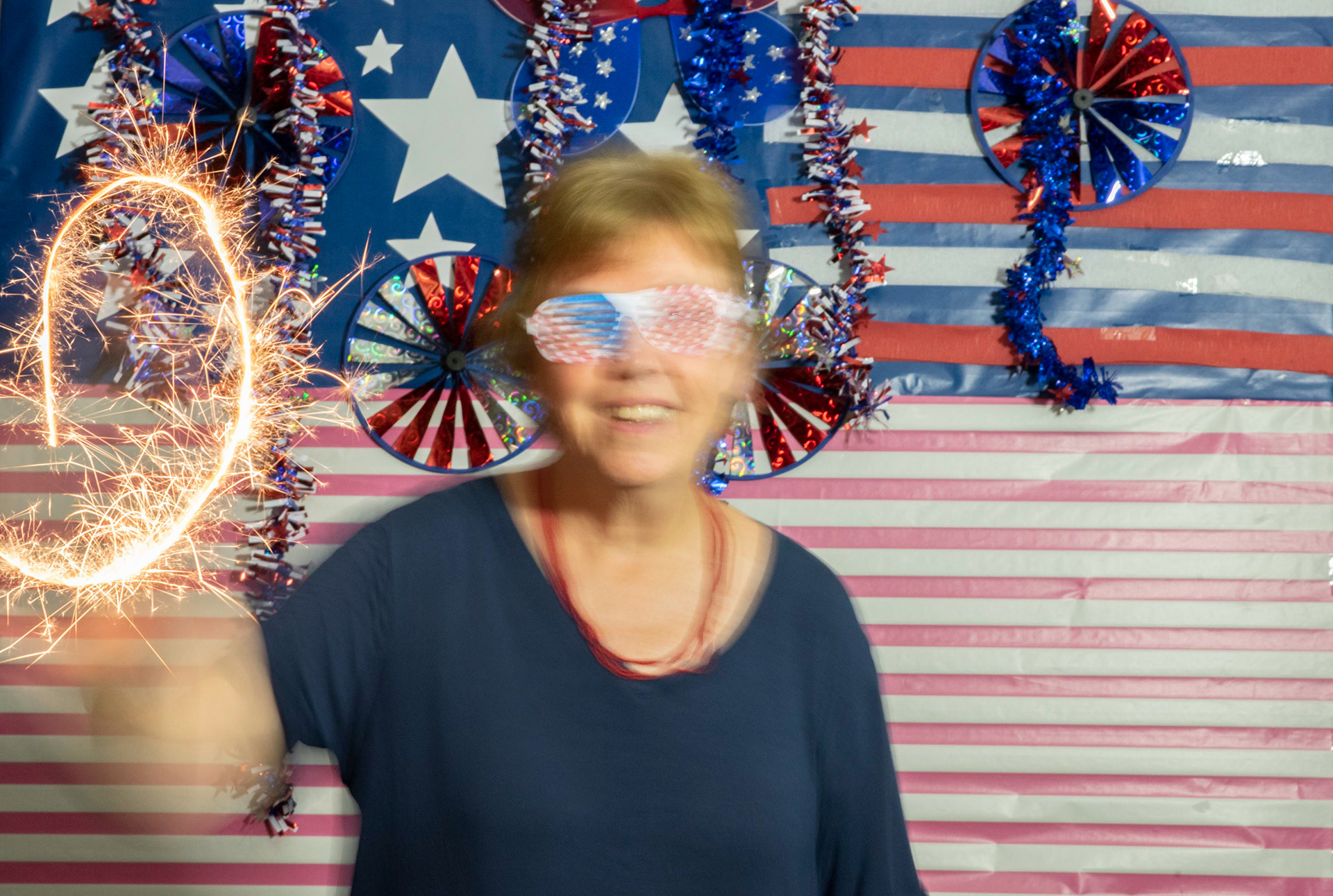 Props, Sparklers, and a flag themed backdrop
