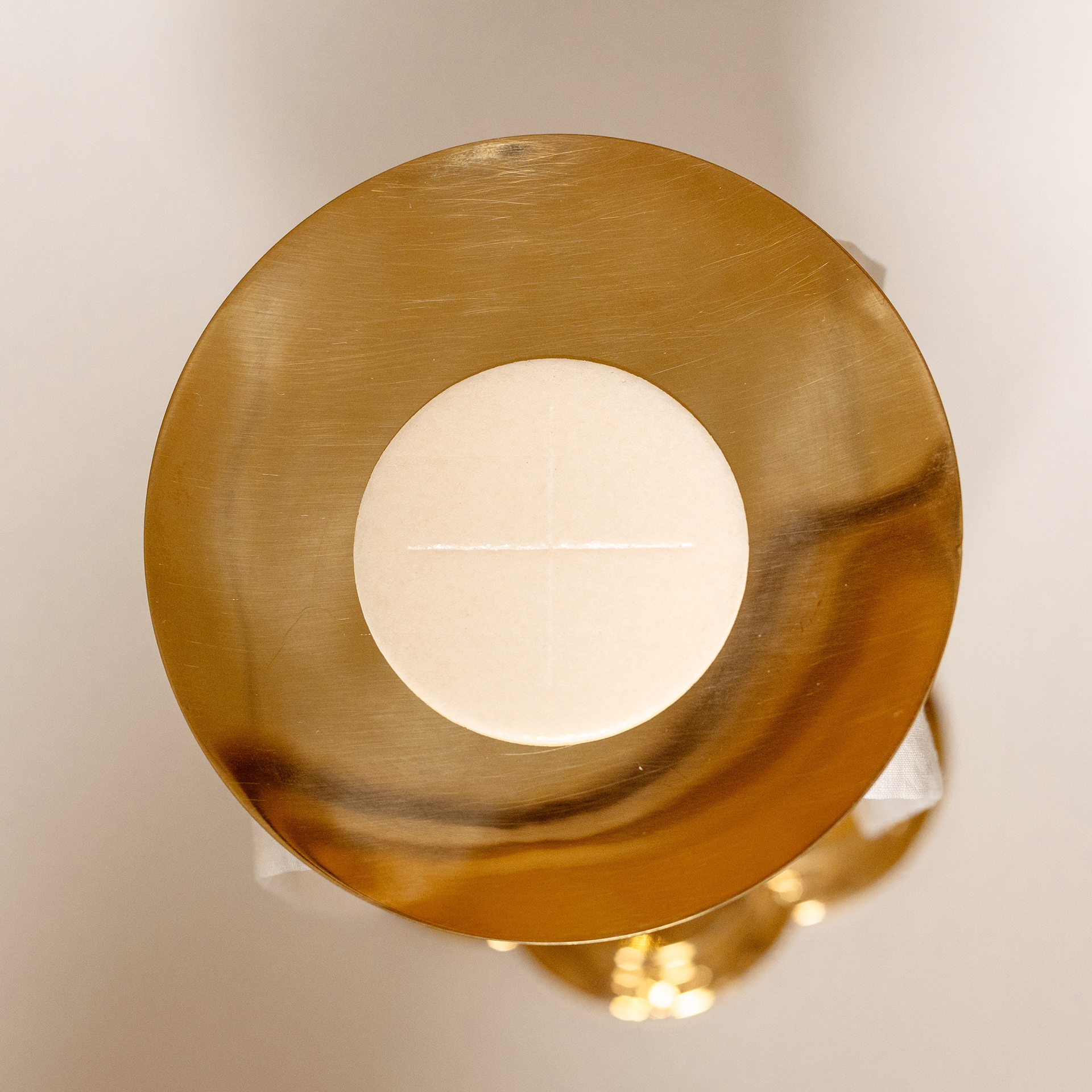 Paten and unconsecrated priest's host