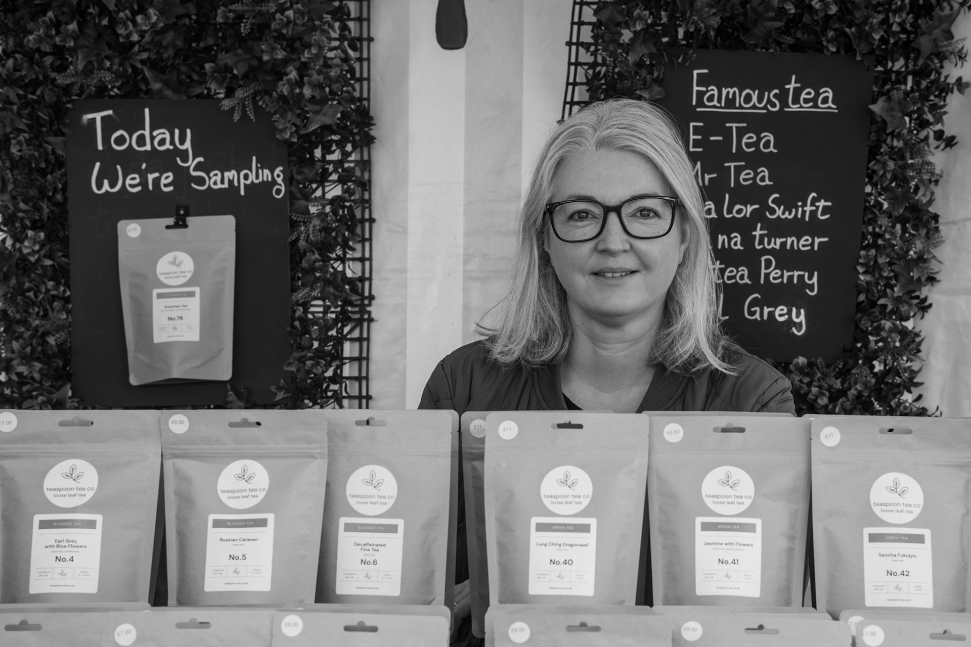 This photo number 5 in my 100 Strangers project. Pam has a stall selling tea at Grantham market and kindly agreed to being photographed. She used to own a Tea shop in Grantham high street with her partner but gave that up and is selling the stock off. I feel that the composition says much about Pam rather than a straight portrait. This picture is #05 in my 100 strangers project. Find out more about the project and see pictures taken by other photographers at the <a href="https://www.flickr.com/groups/100strangers/">100 Strangers Flickr Group page</a>