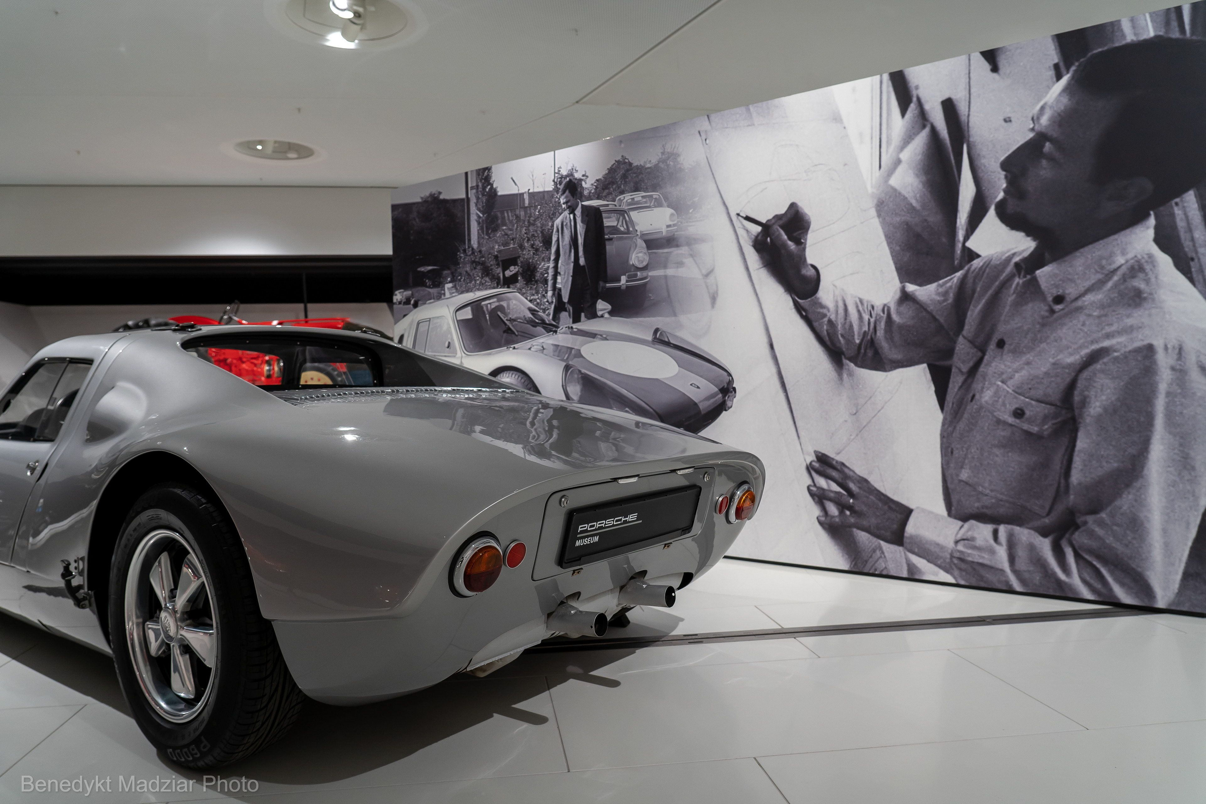 Porsche 904 Carrera GTS (Gran Turismo Sport) designed by F. A. Porsche (or simply Butzi) was the first Porsche car with a glass-reinforced plastic body. The bodywork was developed in cooperation with aircraft manufacturer Heinkel Flugzeugbau. A total of 106 units were produced between 1963 and 1964, with a four-cylinder engine, but of course „air-cooled”. These models were both road-legal and racing-ready. The photo shows one of the only six produced 904 Carrera GTS models from 1963, with a 6-cylinder 160 HP engine from the 911 S 2.0 model. Additionally, another six 904 Carrera GTS models were created also with 6-cylinder engine, but with a power of 210 HP only for racing use, and three models with an 8-cylinder engine and 240 HP, of which two of them took: first and second place in the Targa Florio race in 1964.