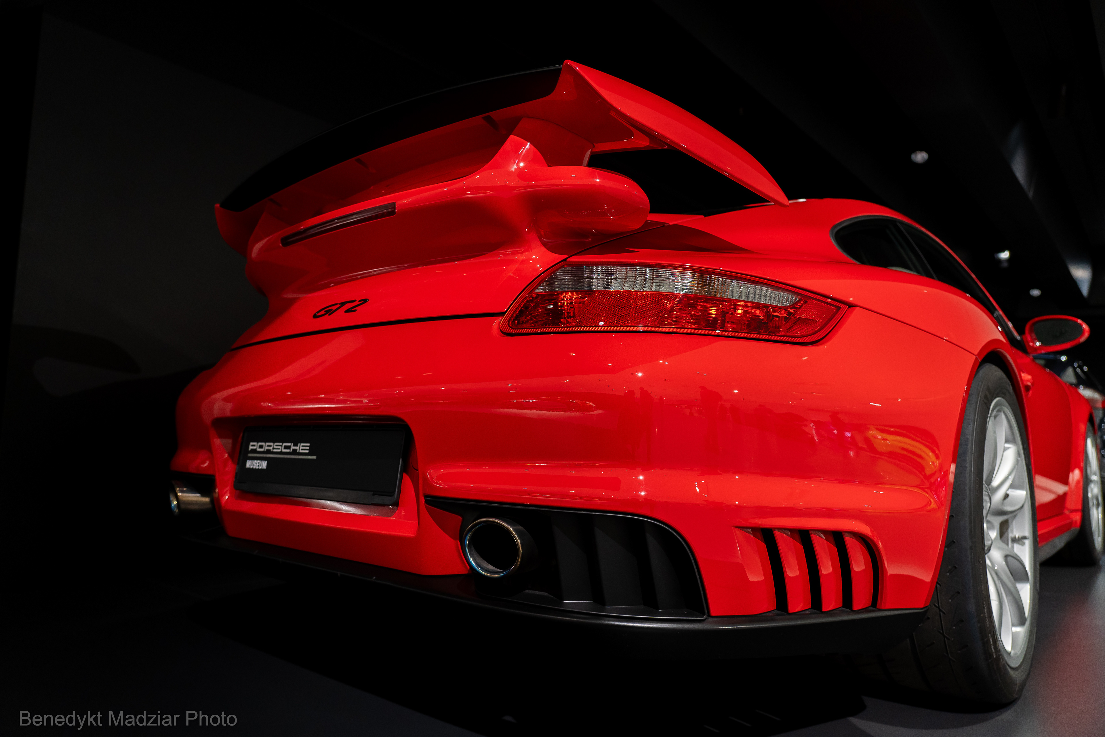 Porsche 911 GT2 (997) is (probably) one of the greatest sports car the world has ever seen. At its world premiere in September 2007 at the IAA (62nd edition) in Frankfurt am Main, it was the most powerful and the fastest Porsche model approved for road traffic at that time. It had a 6-cylinder boxer engine with a power of 530 HP and a torque of 505 Nm, rear-wheel drive, was available only with a 6-speed manual gearbox, and its weight was only 1,440 kg. Although it could accelerate up to 329 km/h, it was slower than the Turbo S model by 0.1 second in acceleration from 0-100 km/h and accelerated in 3.6 seconds. This model was developed - like most sports models - in the Porsche racing department in Weissach. The first GT2 model was created in 1995 (version 993). The model in the photo is from 2008 (version 997).