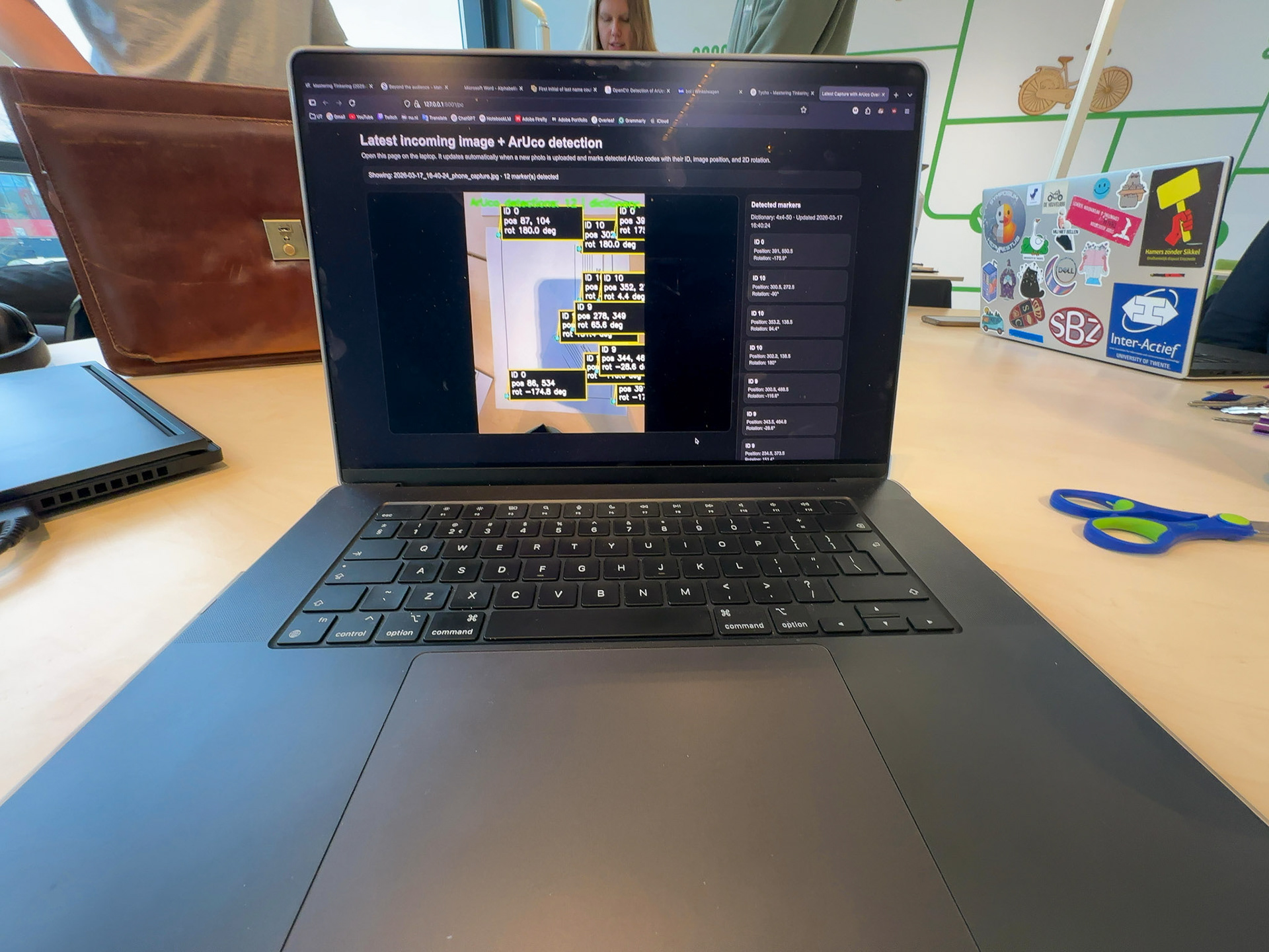 Figure 4. The laptop view with the AruCo codes.