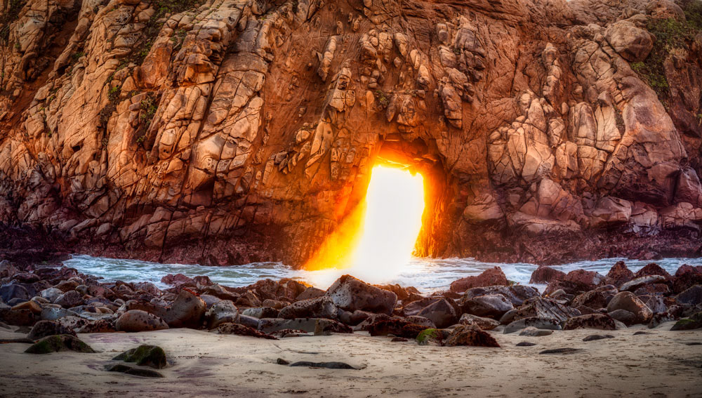 #1027 Late Afternoon Sun Shining Through a Hole in the Rock Wall at Pfeiffer Beach on the Big Sur Coast of California