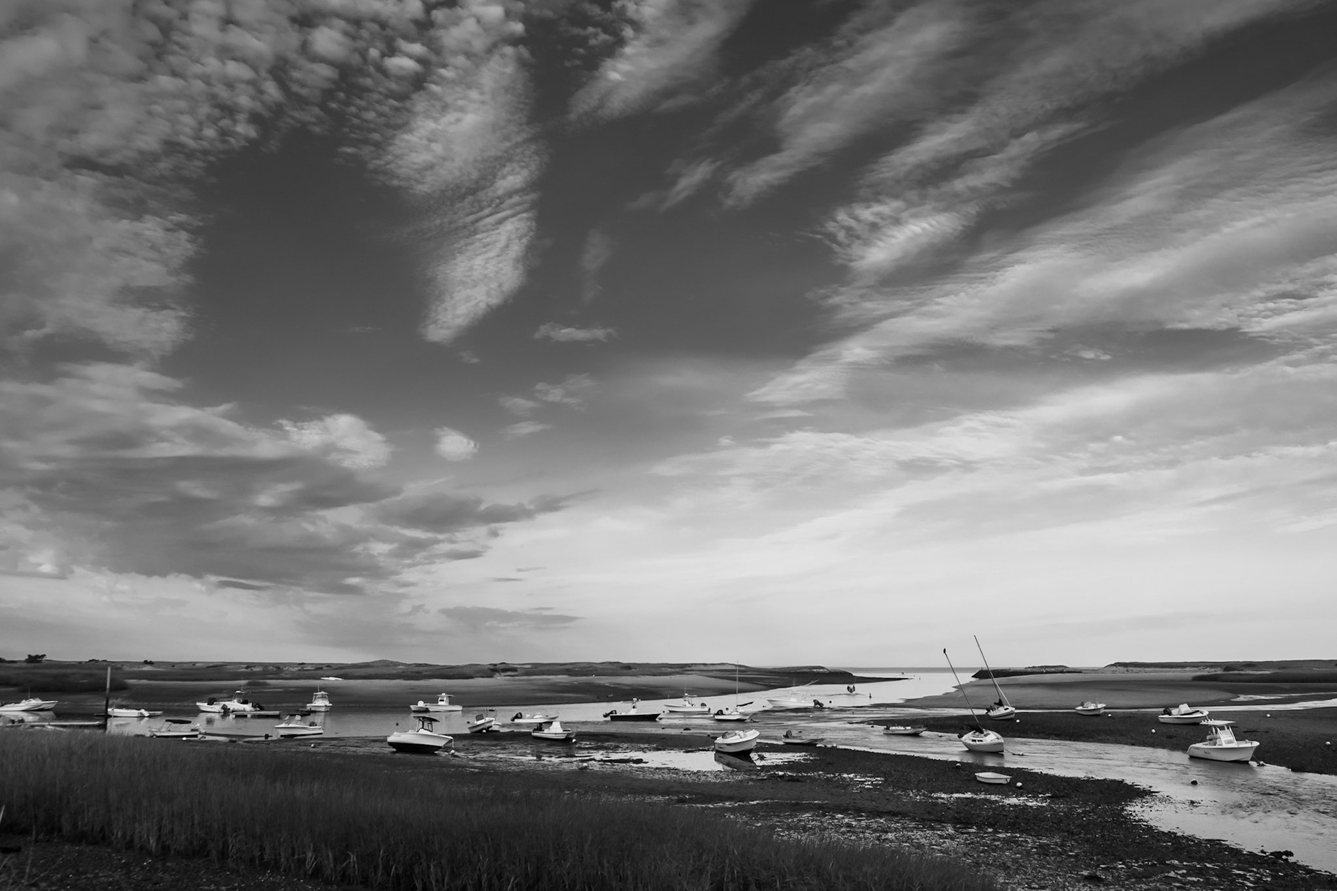 Boats at low tide in the Pamet Harbor, Truro MA.  (photo by Gabe Palacio)