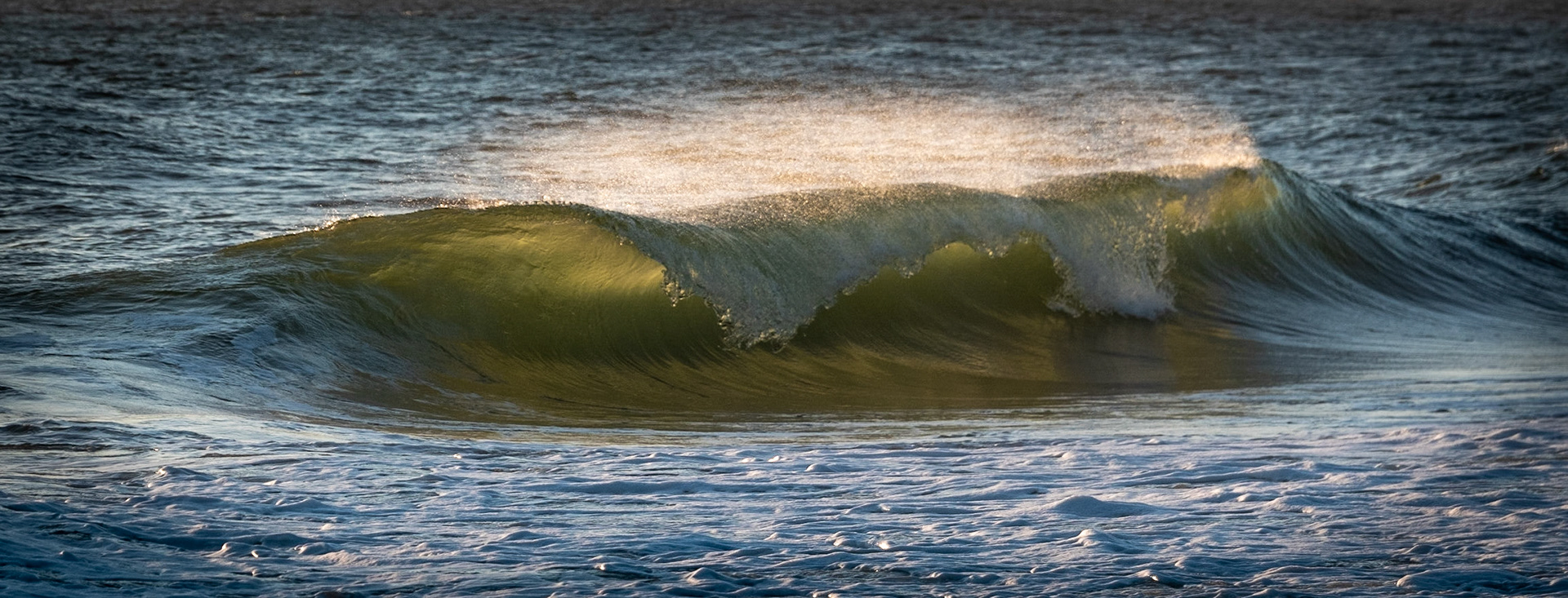 Ocean waves at Sunrise on Ballston Beach in Truro, MA in Cape Cod. (photo by Gabe Palacio)