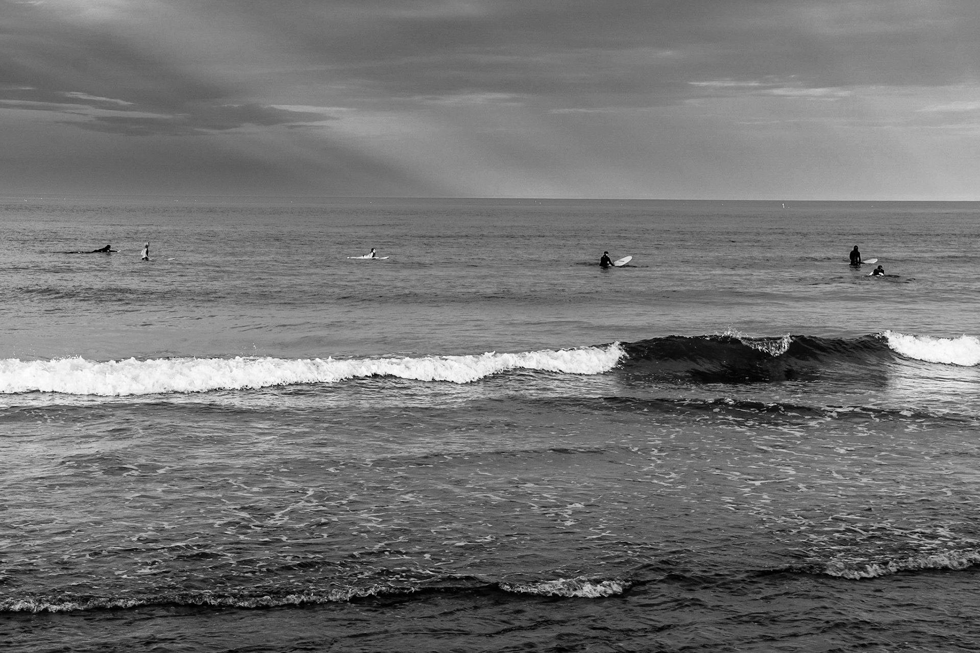 Surfing on Newcomb Hollow Beach in Wellfleet, MA on Cape Cod. (photo by Gabe Palacio)