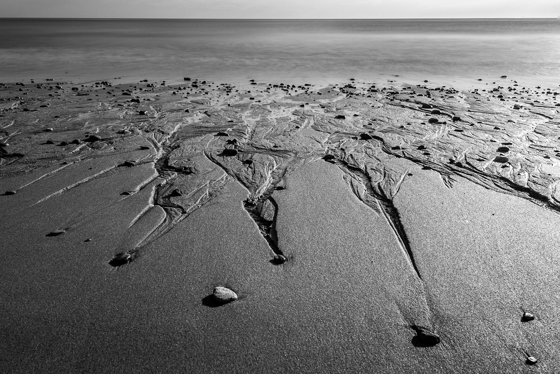 Stones on the beach. (photo by Gabe Palacio)