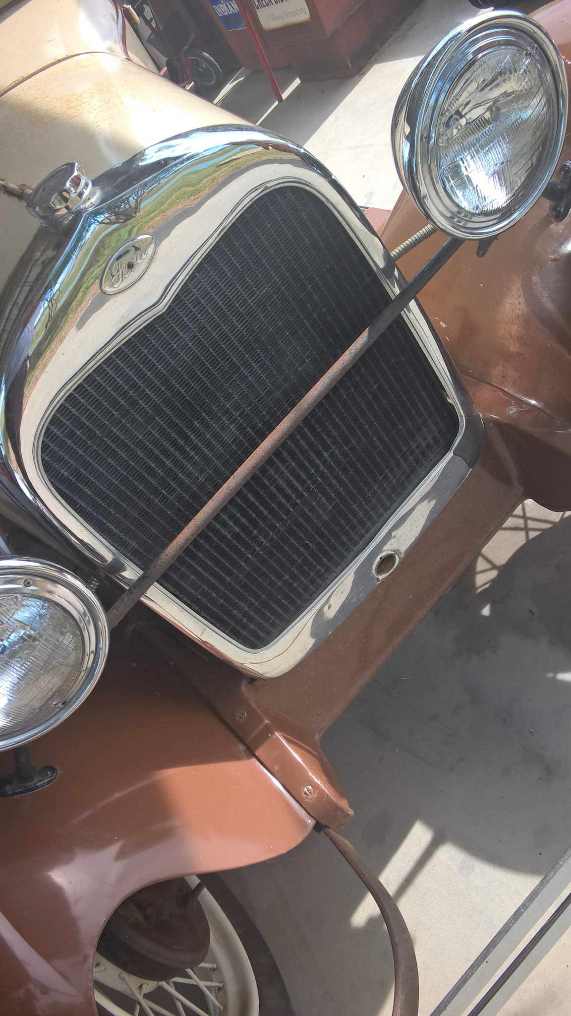 An old Ford model glimmers in the sun
