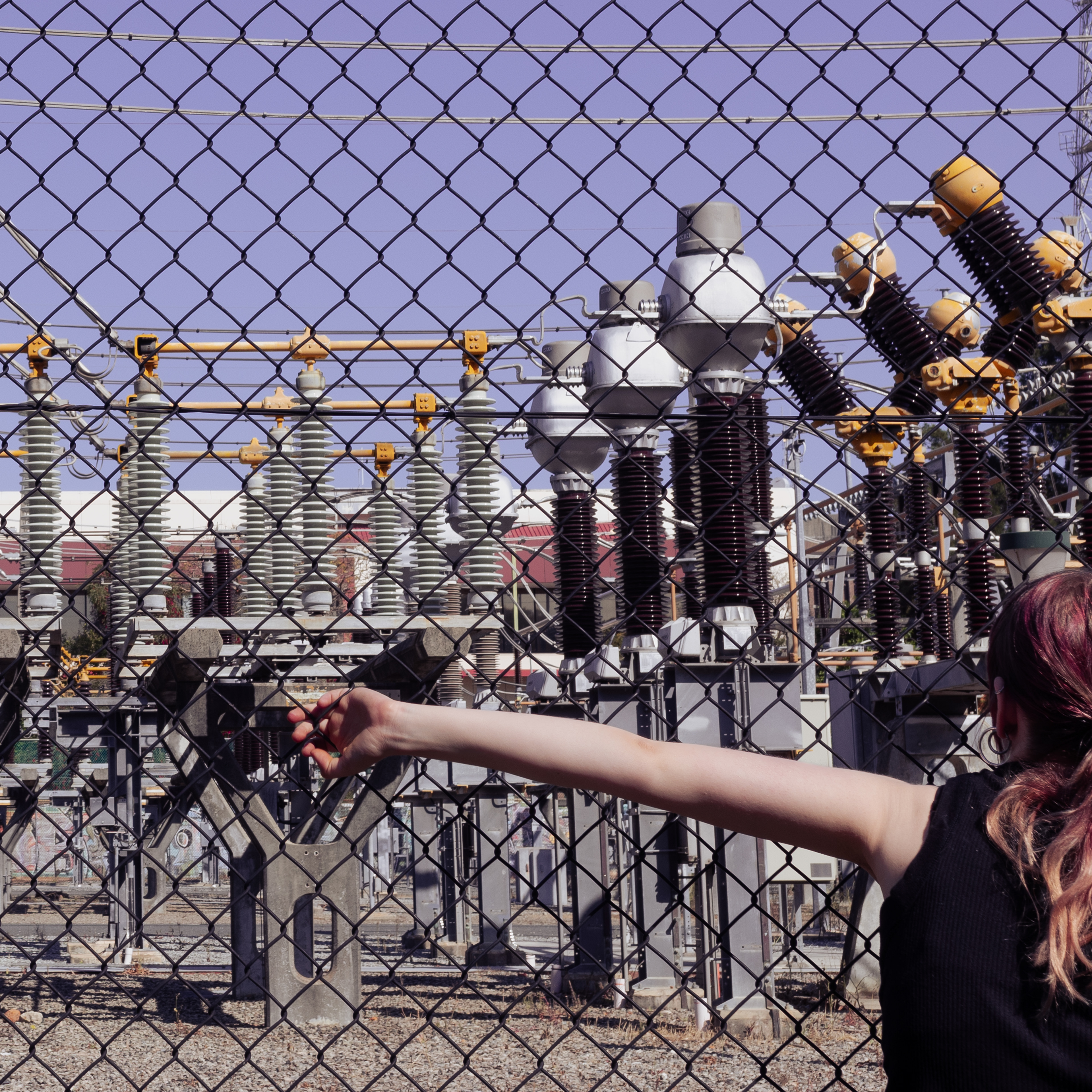 Hex #5. 2023. Photographic print; Makaela Rowe-Fox at East Perth terminal substation, camera assistance from Victoire Hemedi. 15x15 inches.