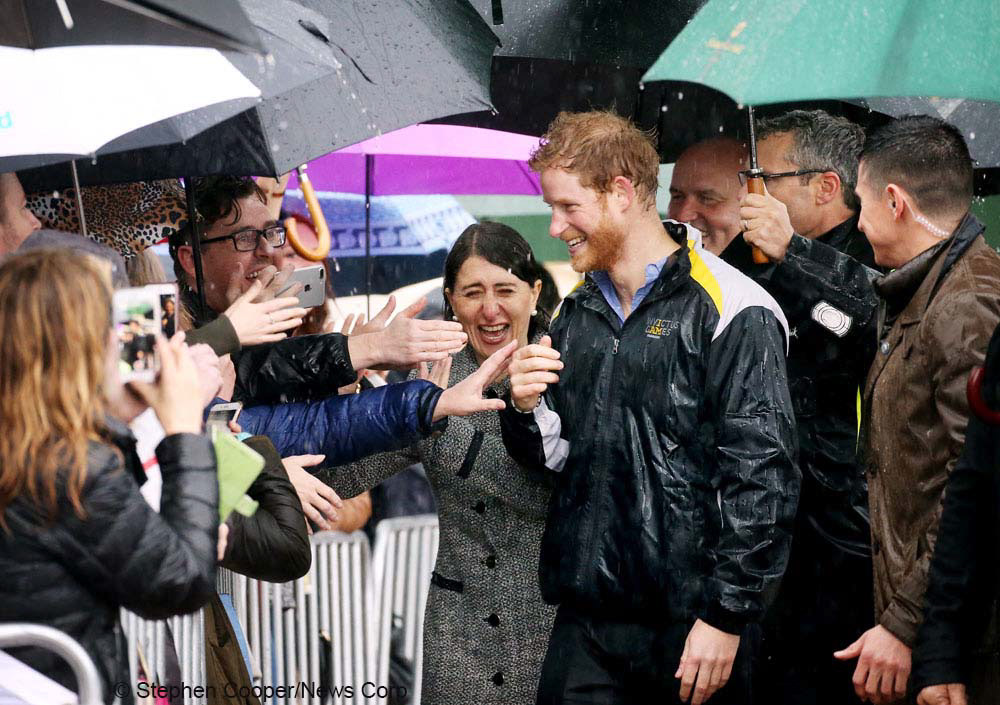 NSW Premier Gladys Berejiklian with Prince Harry in Sydney to promote the Invictus Games meets the public at Campbell's Cove, Sydney in a heavy rain. Picture: Stephen Cooper, News Corp