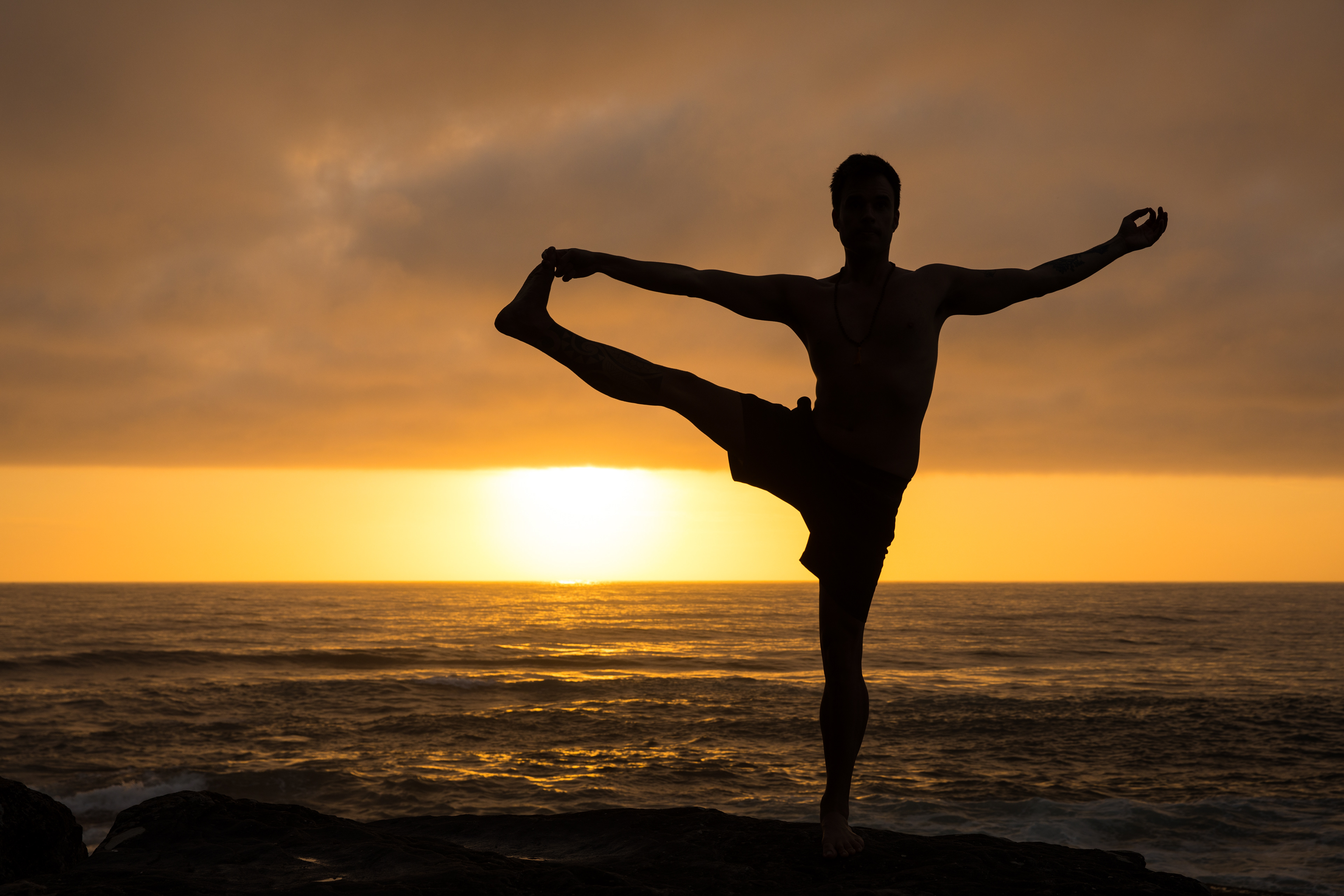Yoga instructor Julio Zavagli practices yoga at sunrise in Manly. © Stephen Cooper