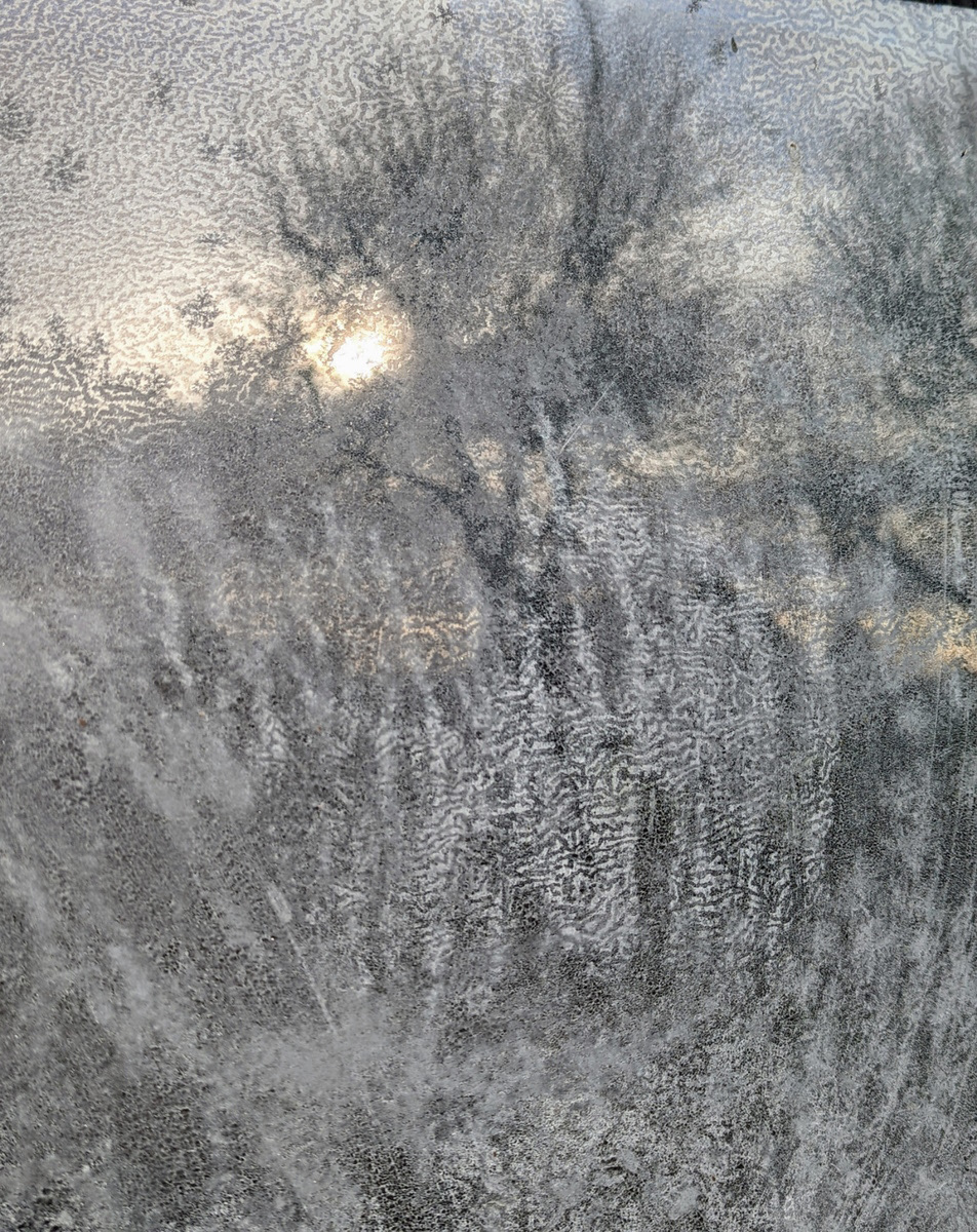Reflections - frosty window by Paul Beck