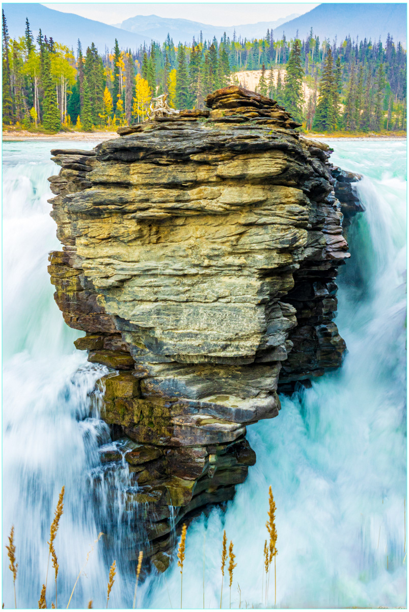 SCORE 9.0 Rock anchored in waterfall by Phil Day