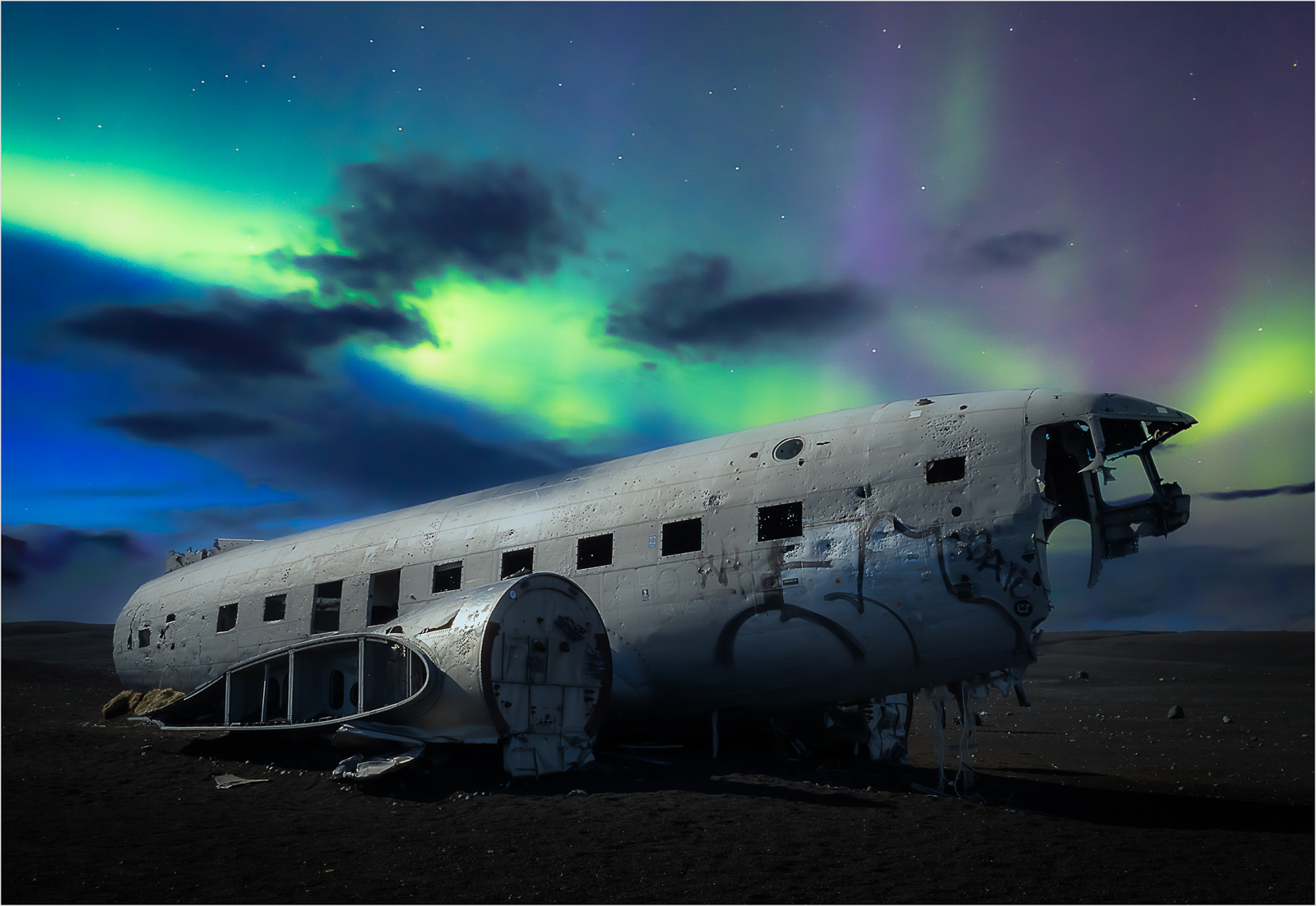 HELD BACK  DC3 Plane Wreck under the Northern Lights, Iceland by Richard Knapp  LRPS