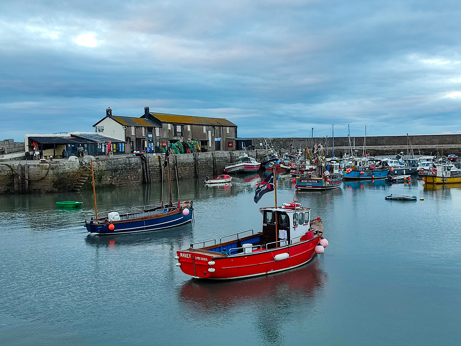 Red Boat in Lyme Regis Harbour by Catherine Allum