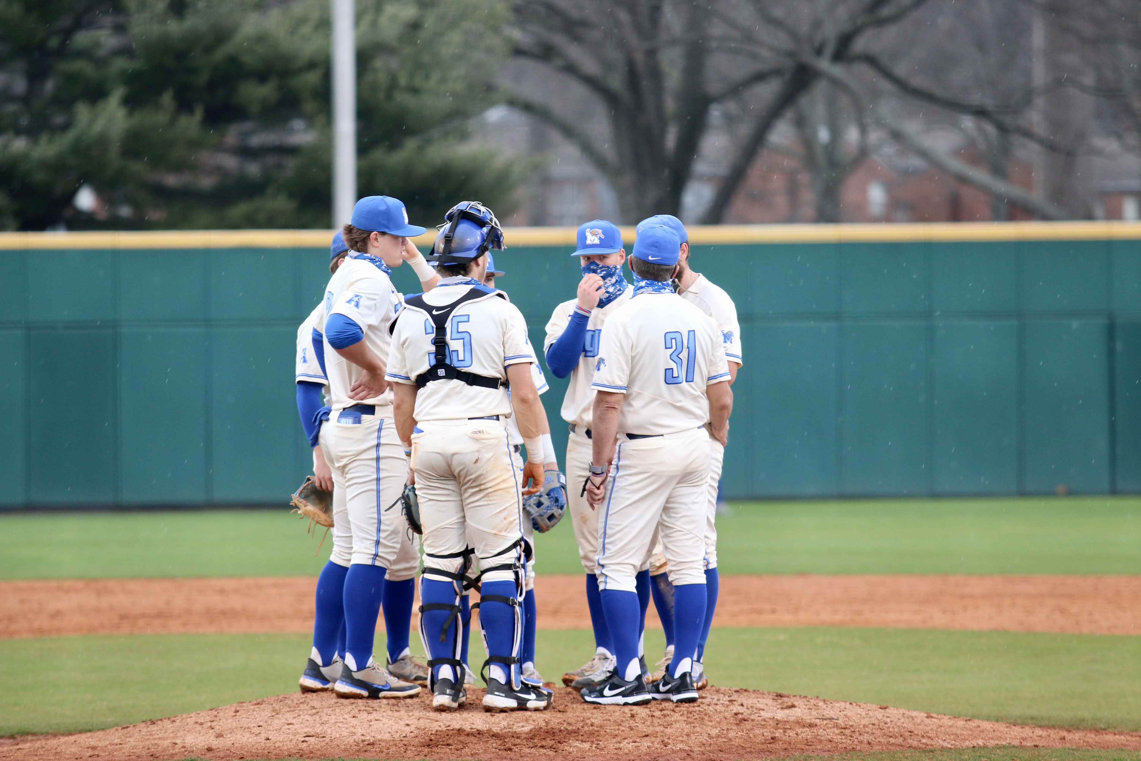 Memphis Baseball huddles around the Pitchers Mound