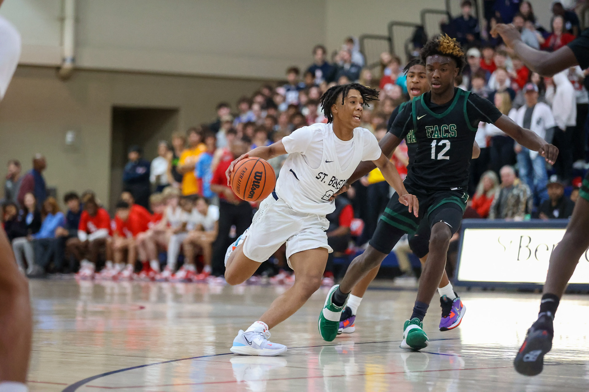Damion Cox drives towards the basket.