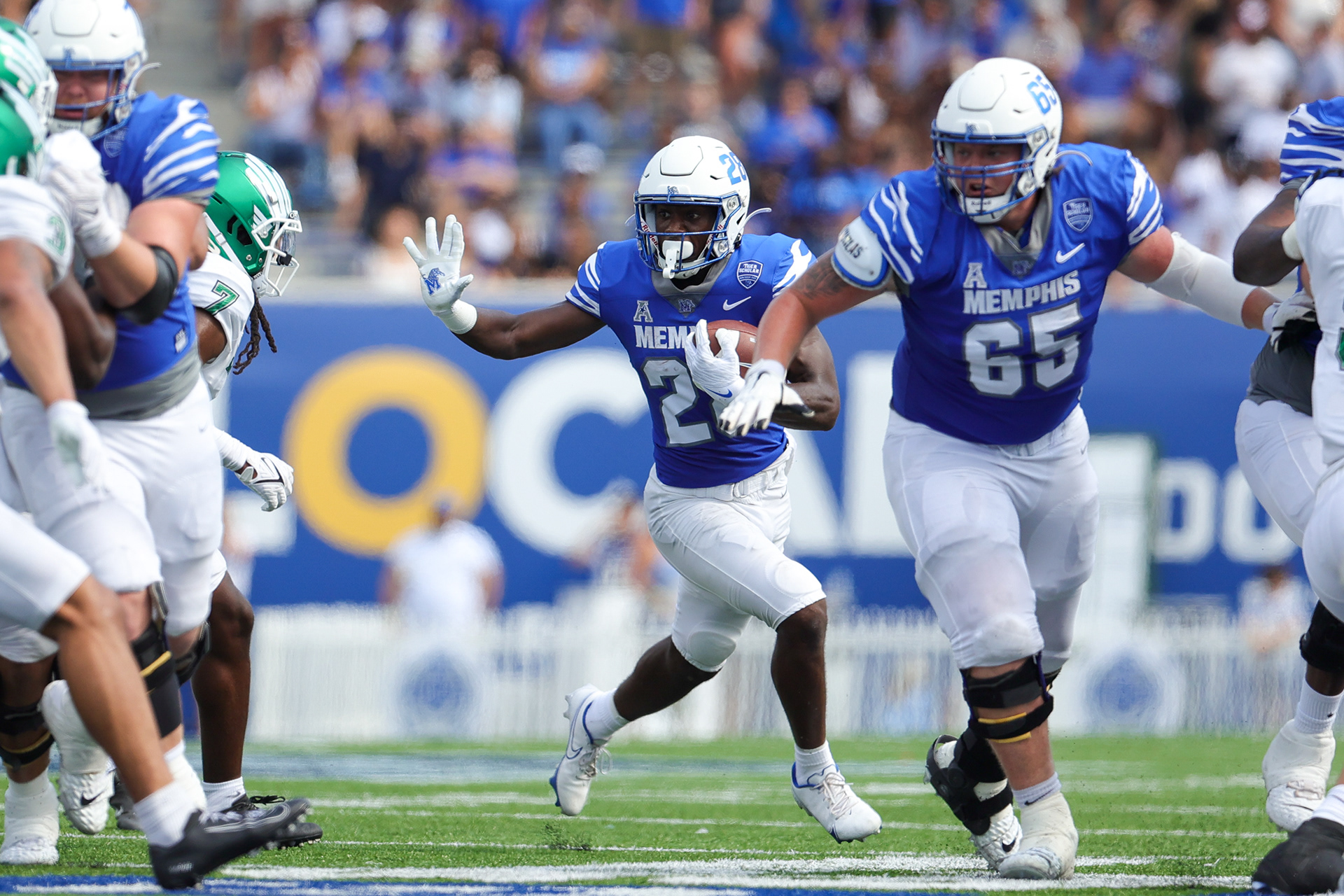 Memphis Tigers Running Back runs down field
