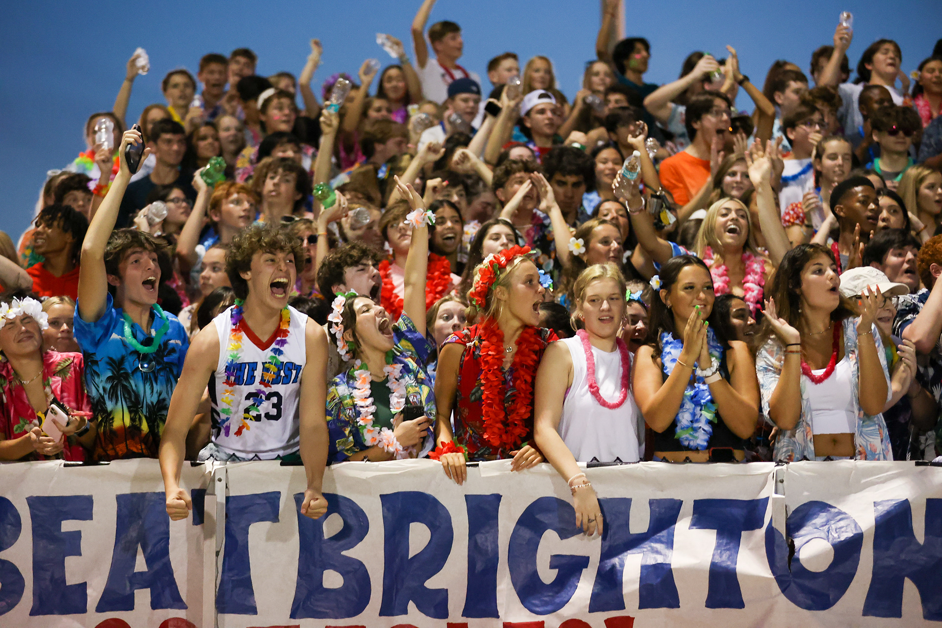 Fans cheer on the football team.