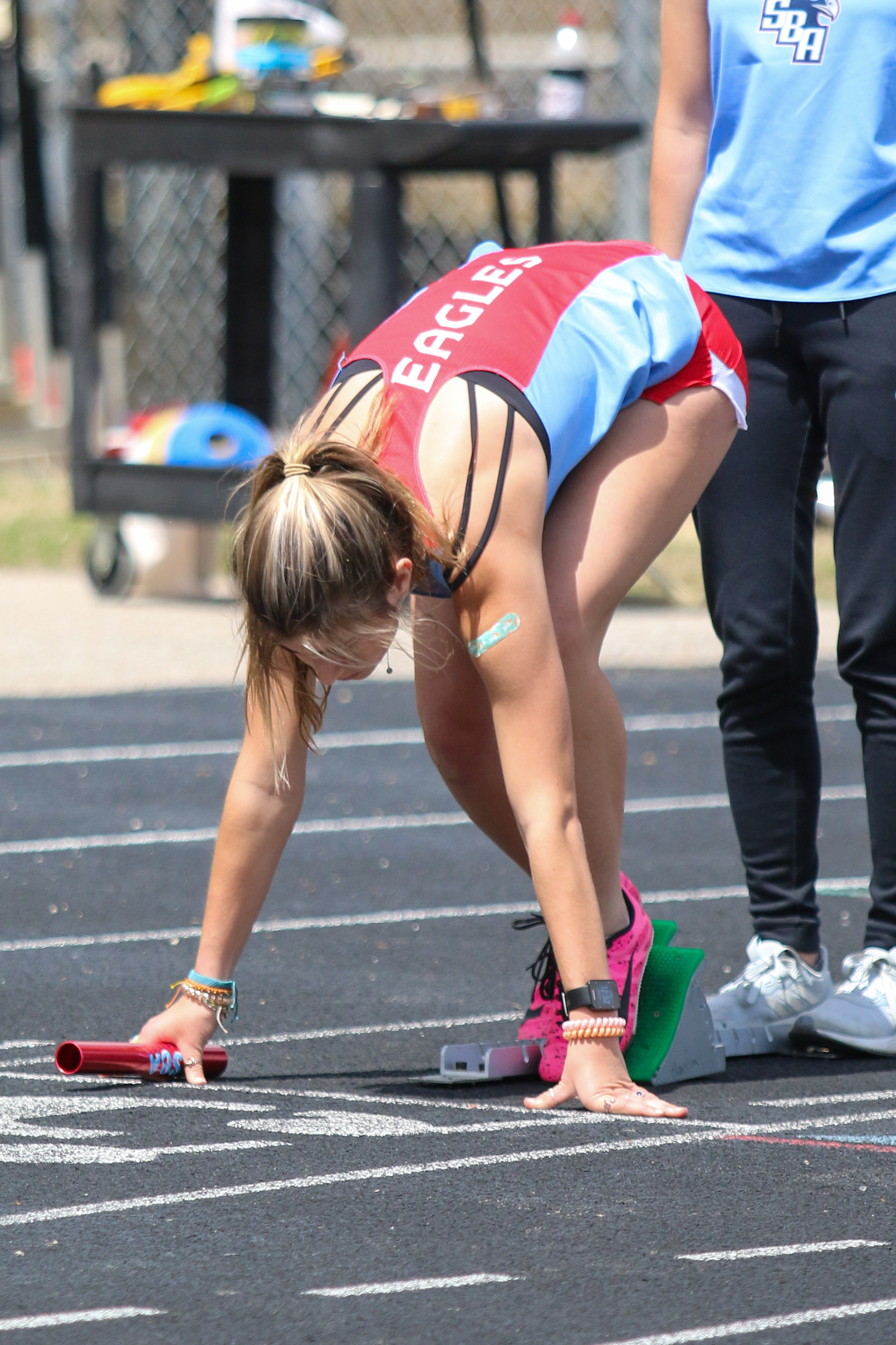 An Eagle takes the track before a relay.