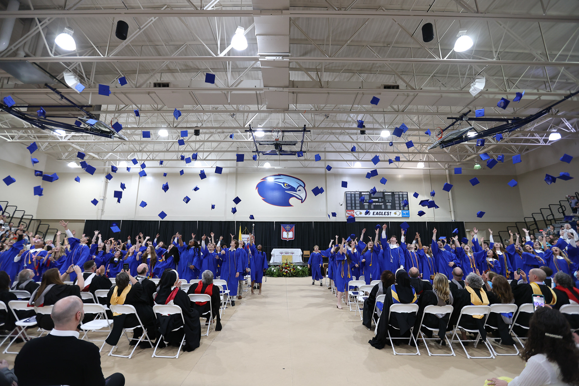 SBA Class of 2022 throws their caps into the air.