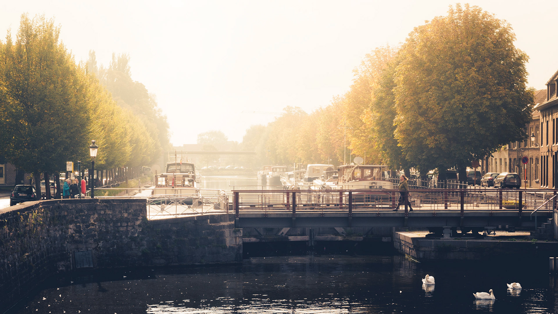 Autumn in Bruges is wonderful. Here you can see one of the many bridges over the numerous canals in Bruges. This canal is called "Copure". Enjoy!