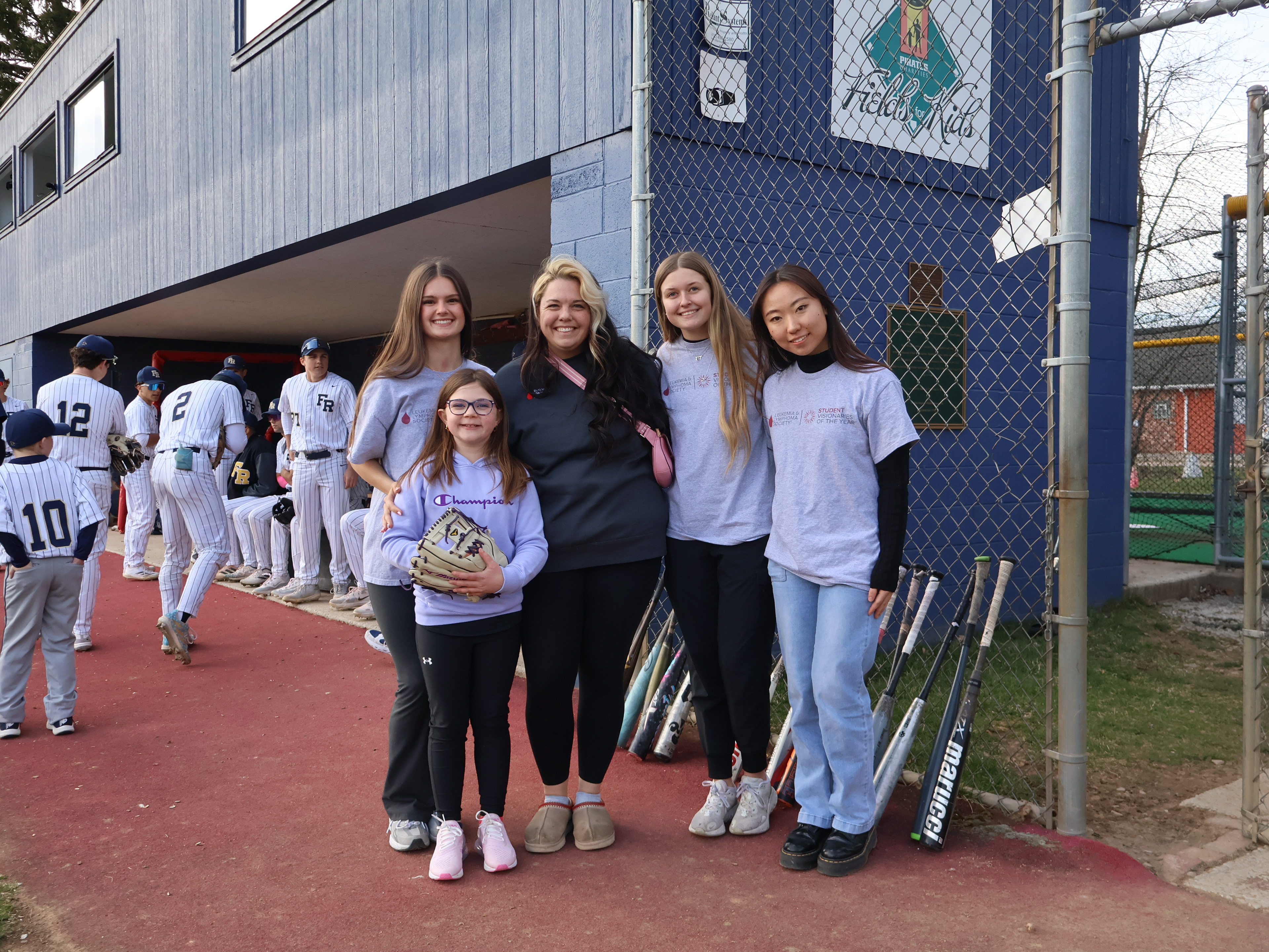 Leukemia and Lymphoma Society sponsors an emotional first pitch at a local high school baseball game. The first ball was thrown by a cancer survivor, who's only in elementary school.