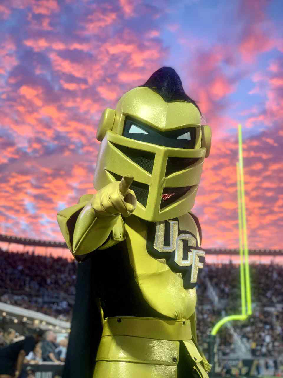 UCF's mascot Knightro at an evening football game.
