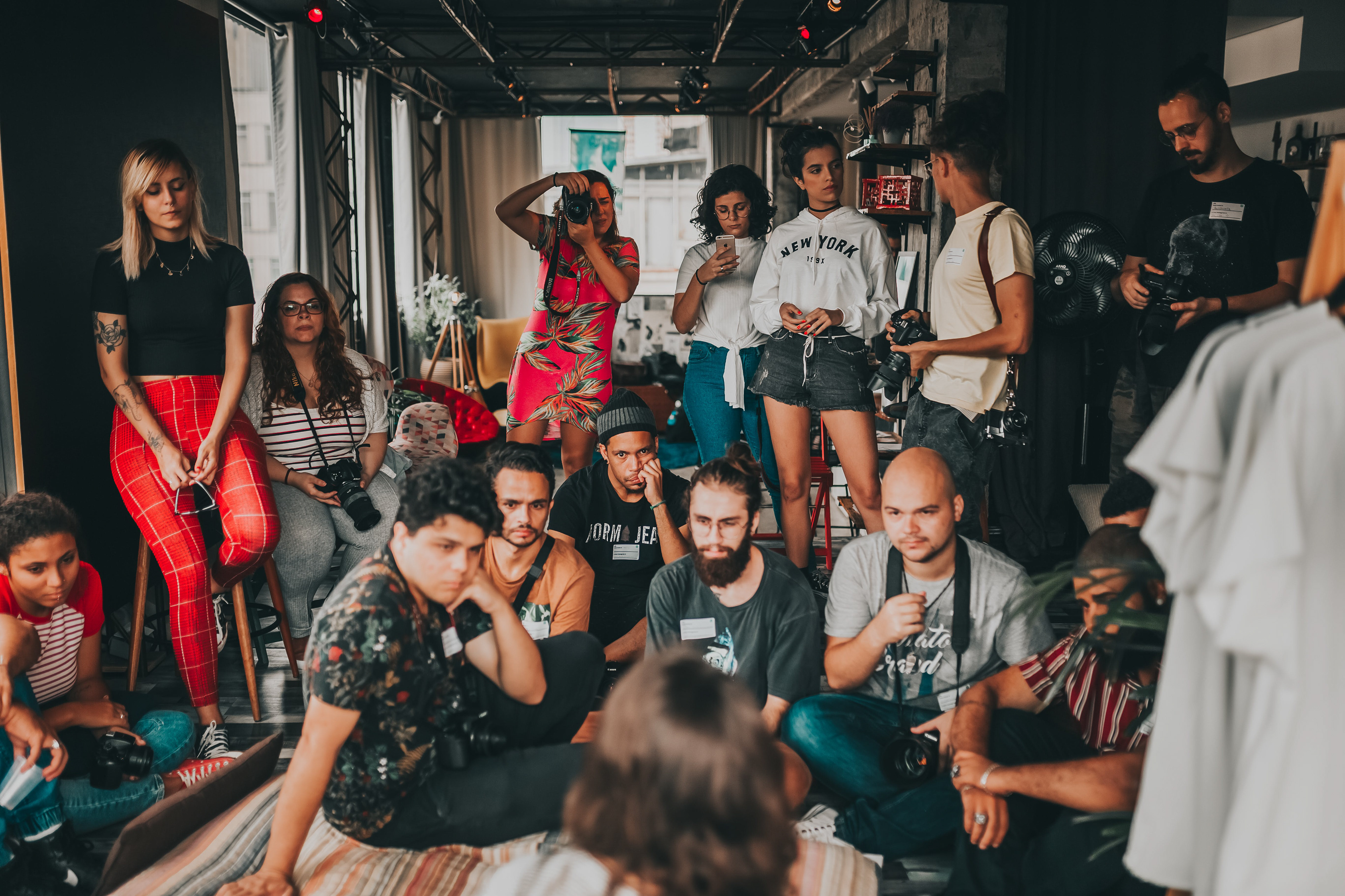 Group of diverse individuals sitting and attentively listening during a CLVR LABs event.