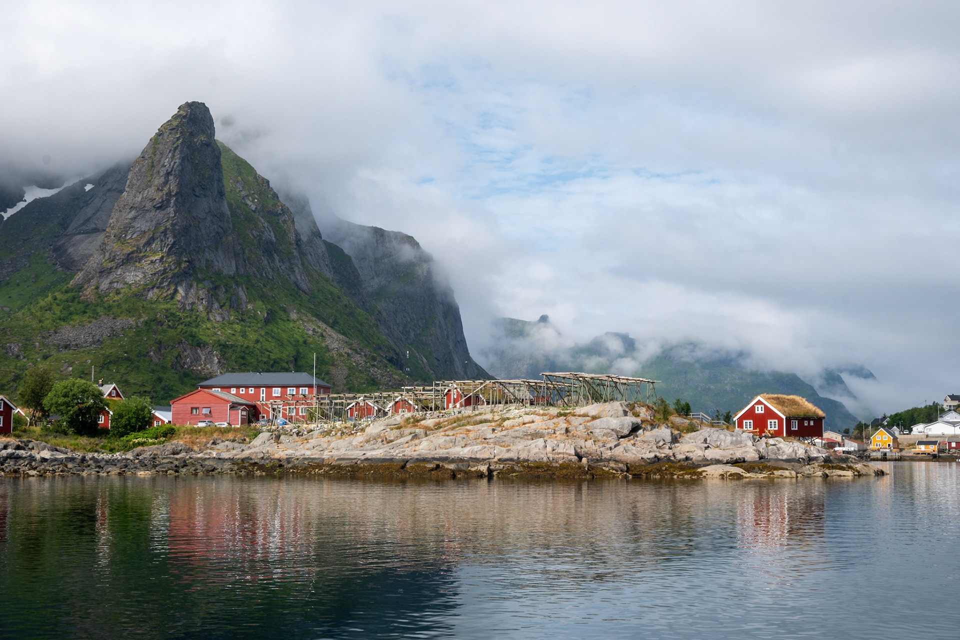 Day 9 - after hiking from Kvalvika beach to Horseid beach we were unfortunately rewarded with more rain and clouds. The following day however, we hiked to a small village (less than a dozen houses) called Kirkefjord and took a ferry to this fishing village, Reine. Reine is a touristy spot, with many people coming to visit the picturesque buildings and hike the Reinebringer mountain. We stayed in a communal hotel with yoga and a sauna and met a couple Norwegians, Finns, and Canadians.