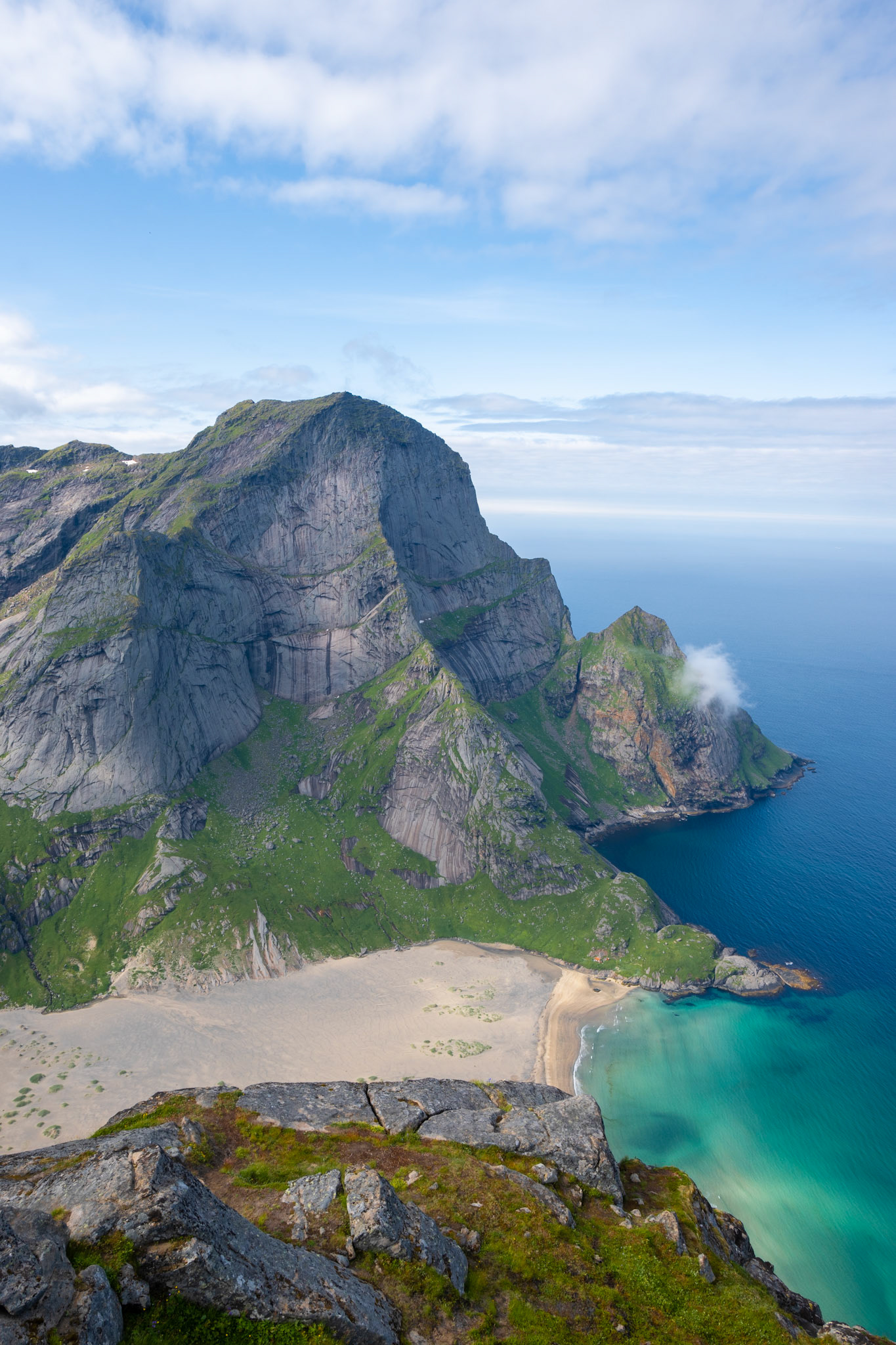 Day 11 - the following morning we hiked back up to the top of Helvetestinden to see the view without clouds. Had a rewarding view of Buneset beach (pictured) and the surrounding mountains.