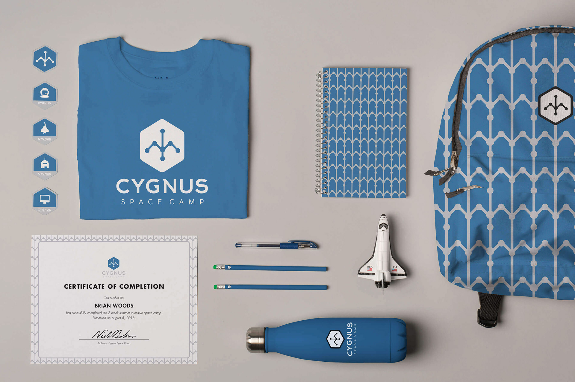 Payoff shot showcasing branded collateral for a summer space camp