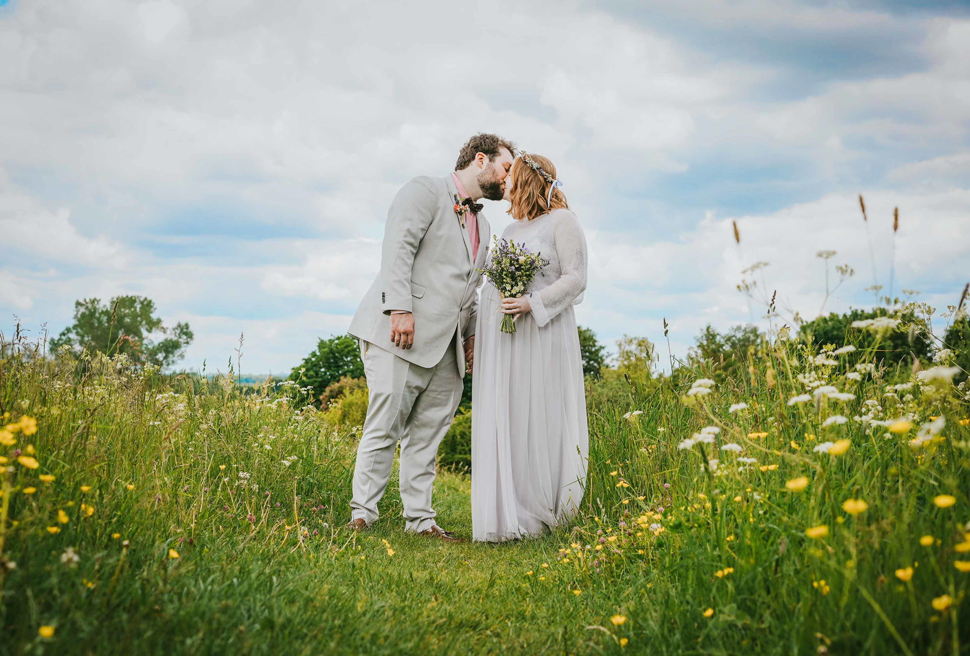 dramatic image of bride and groom kissing in somerton meadow near bicester by david lefebvre a wedding photographer from bicester