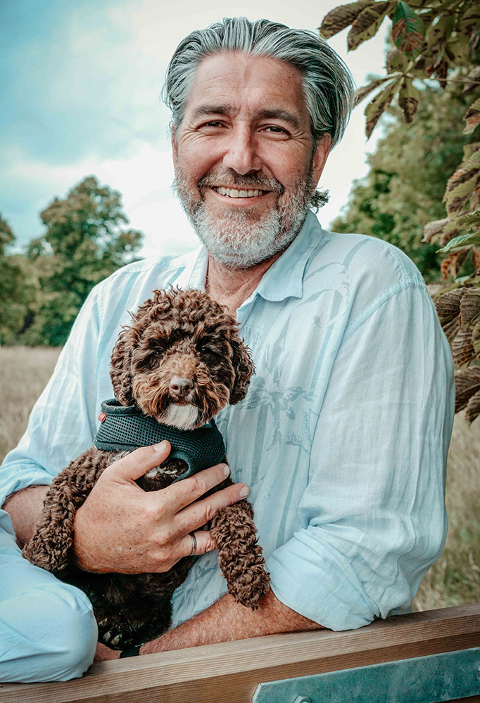dad with dog stood in wheat field in oxfordshire england near blenheim palace with david lefebvre portrait photographer