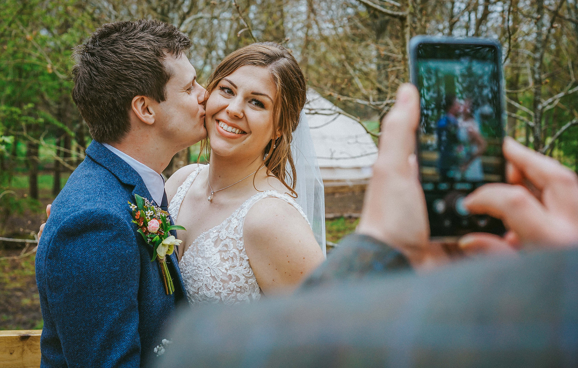 top 10 essential wedding photo shot of bride and groom having picture taken in woods on iphone by buckinghamshire photographer david lefebvre