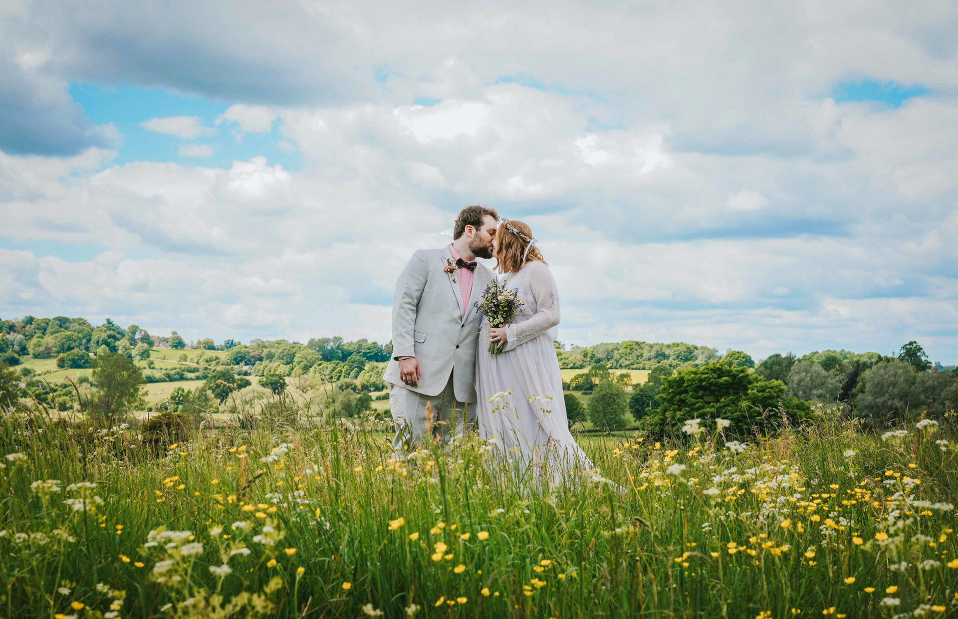 dramatic image of bride and groom kissing in somerton meadow near bicester by david lefebvre a wedding photographer from buckingham uk
