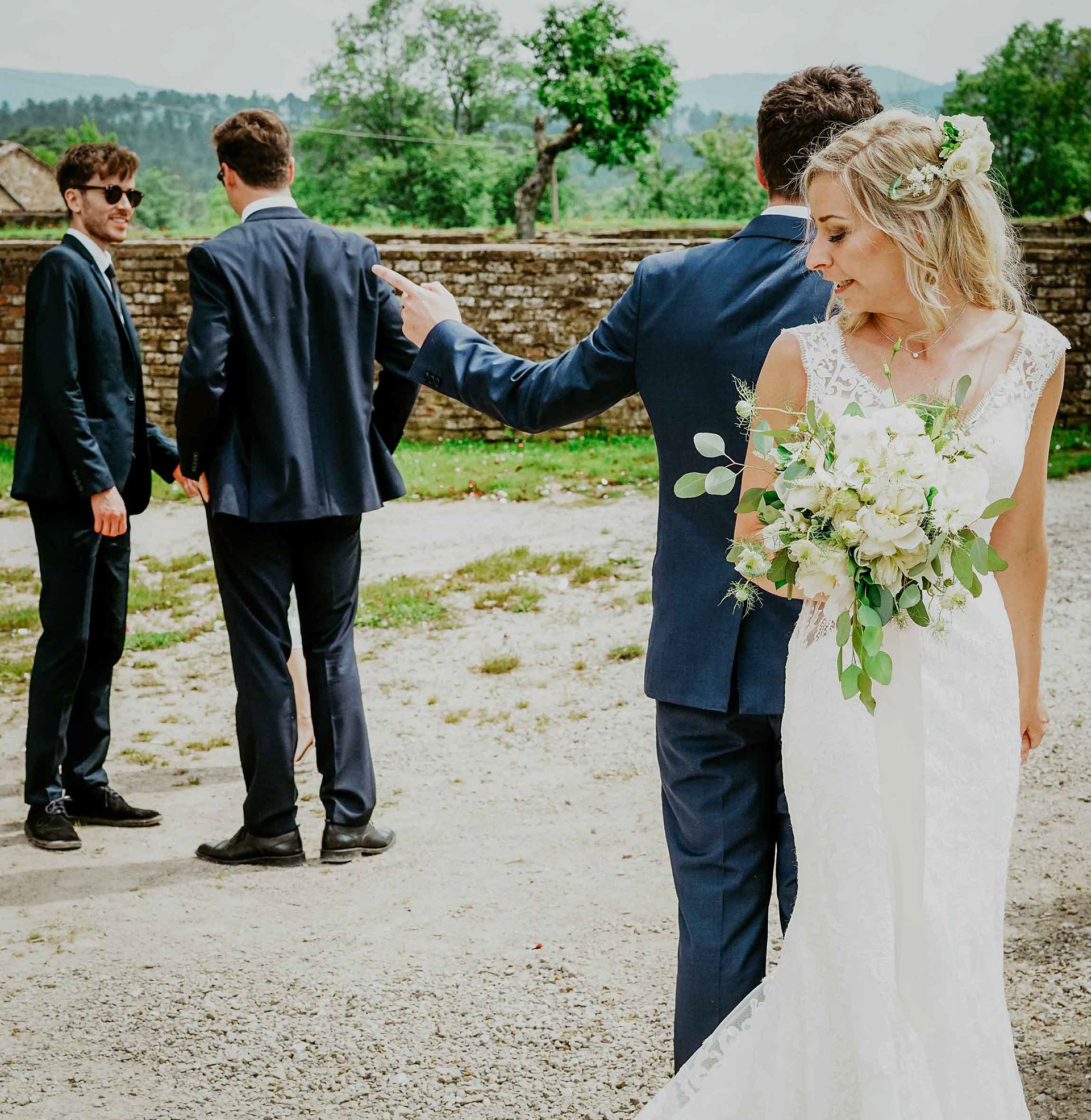vintage look bride with bouquet outside abbey