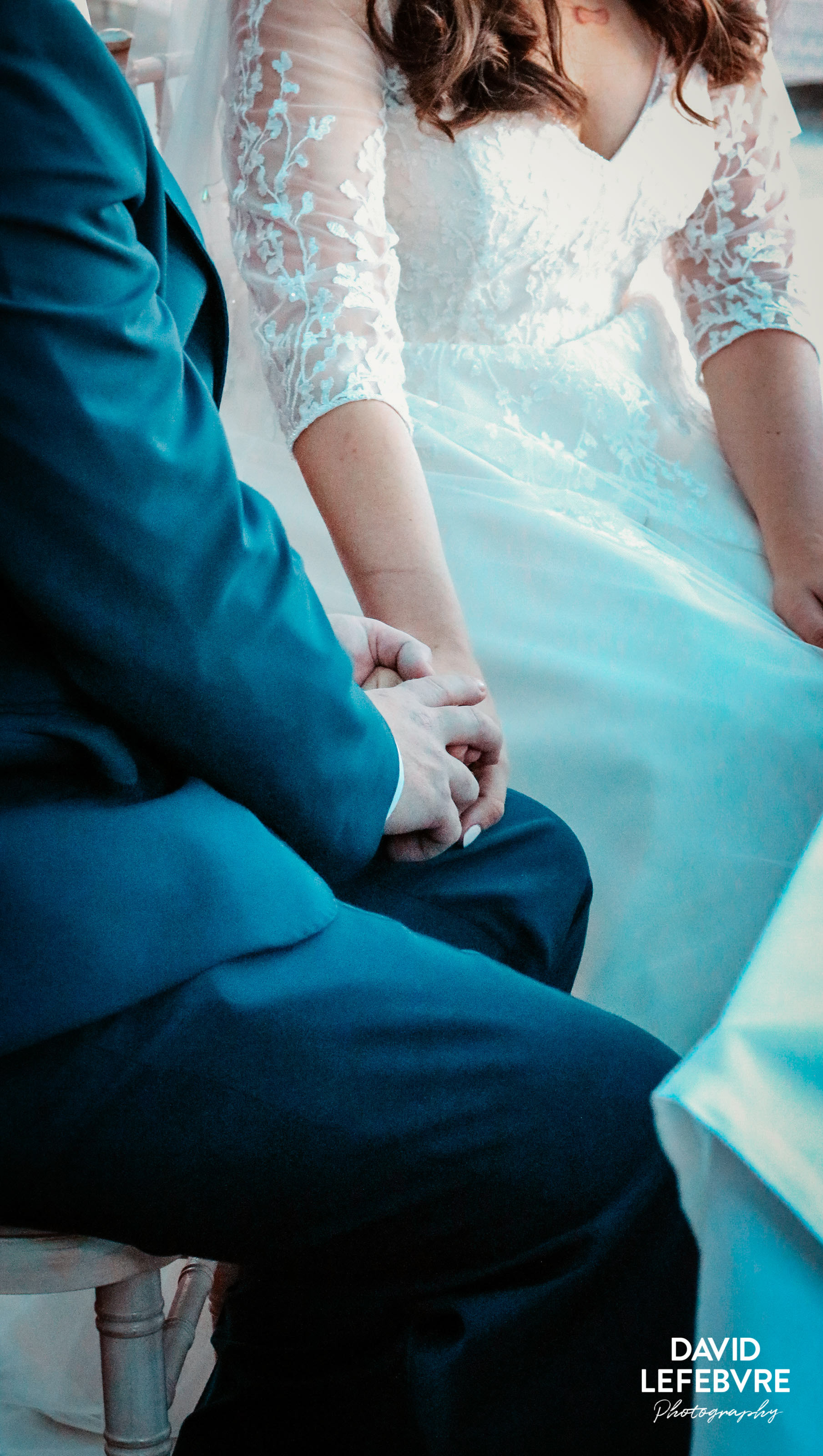 bride and groom holding hands at wedding