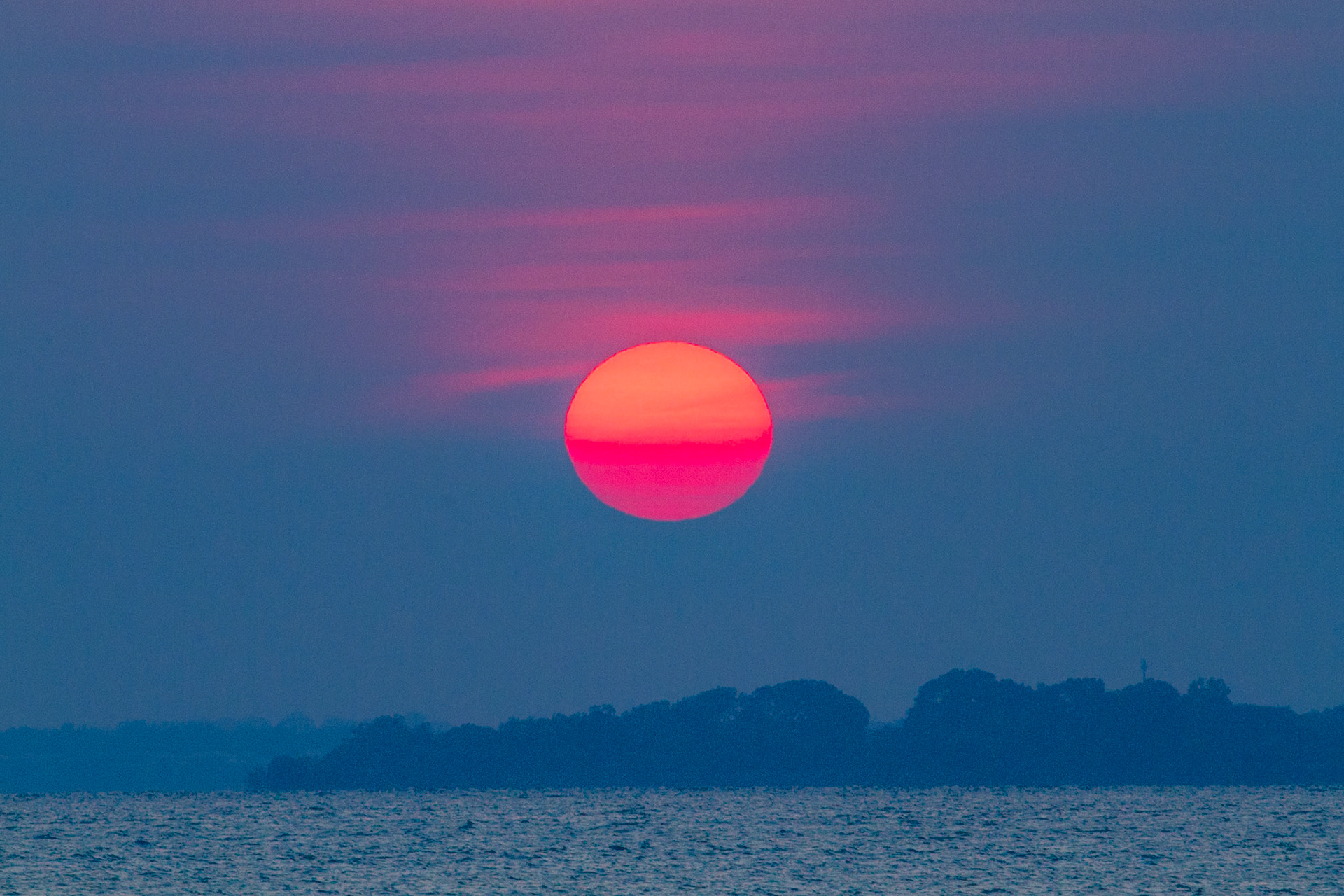 This colour hasn't been edited.  This was the colour of the sun rising over Darwin.