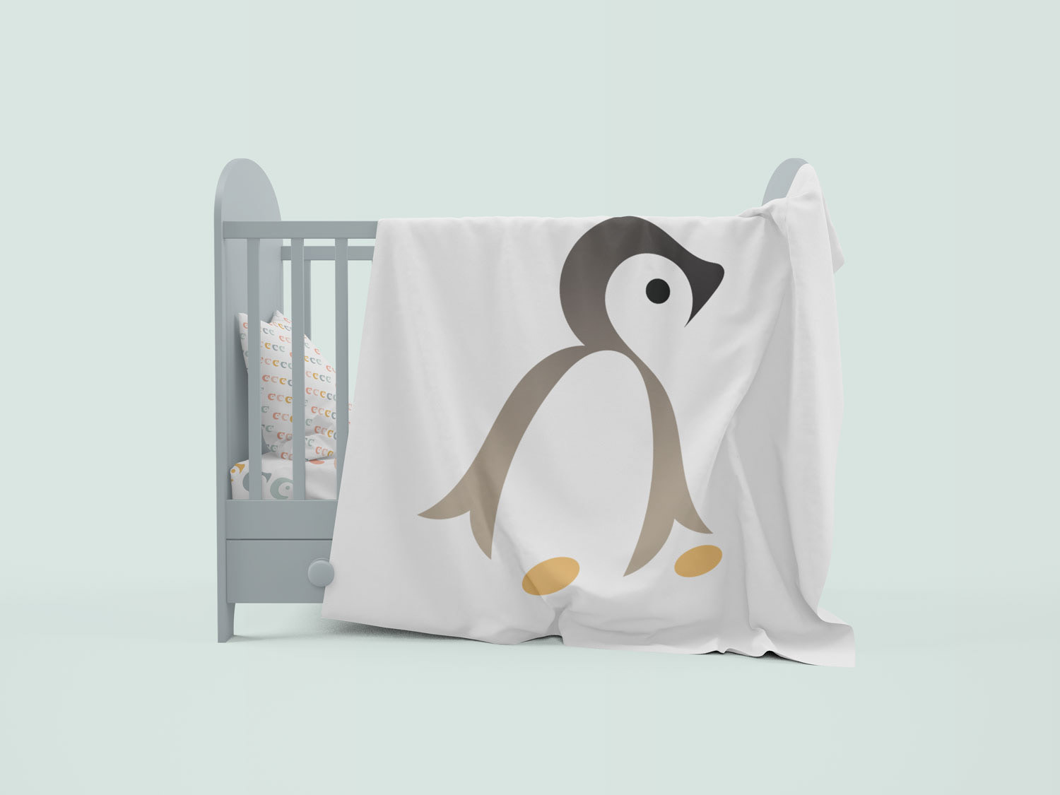 Baby Mine blanket showcasing the logo on a baby crib