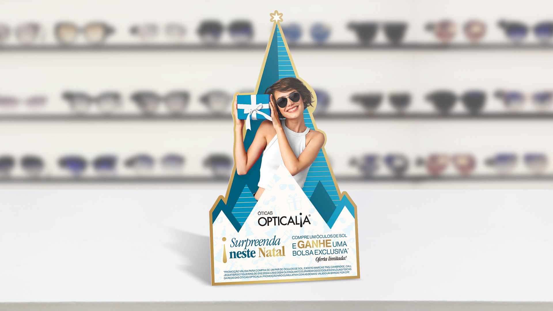 Image may contain: Display de balcão da campanha de natal da Opticalia 2024.