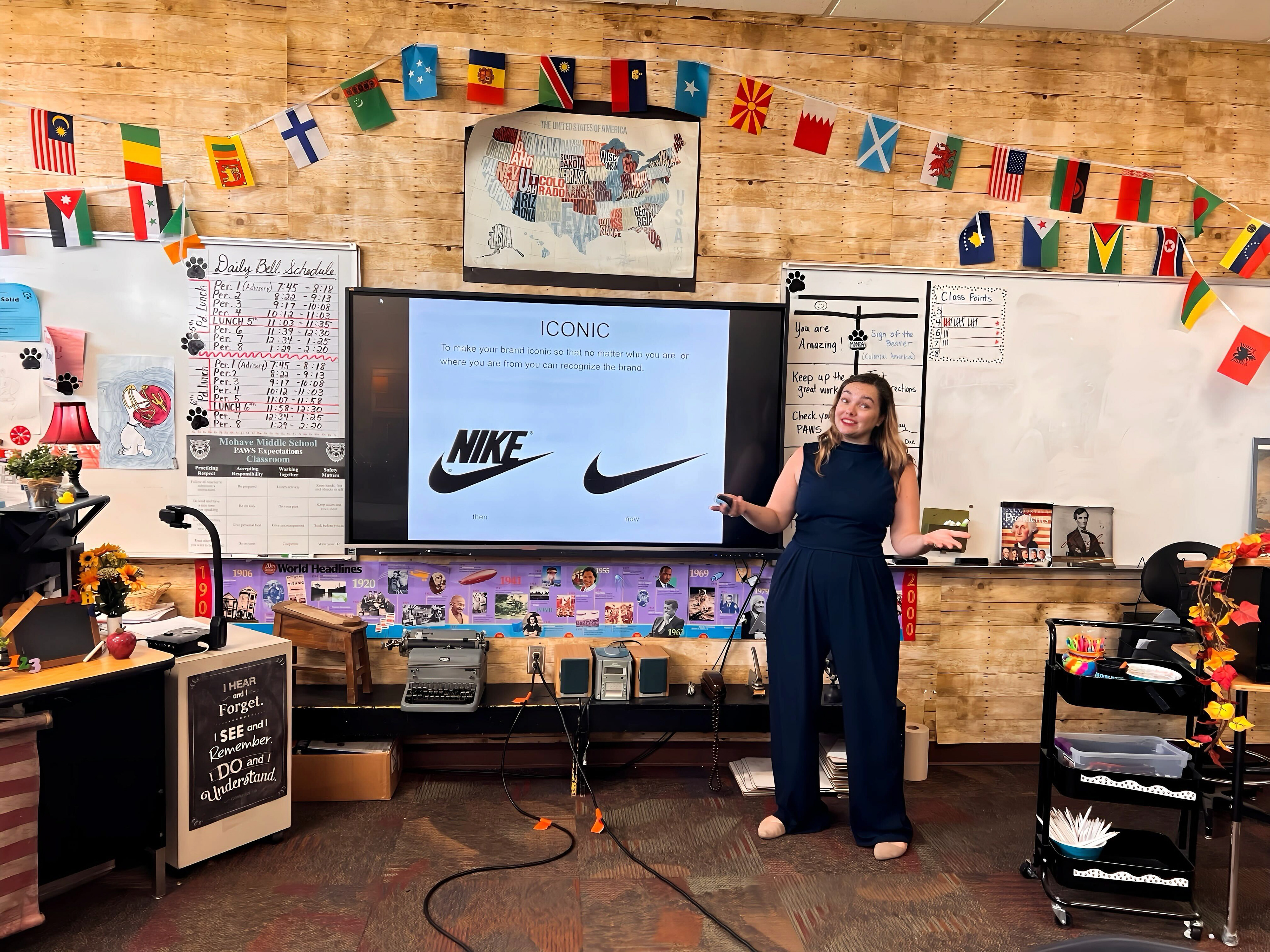 Mary talking about the history of design and change at a middle school.