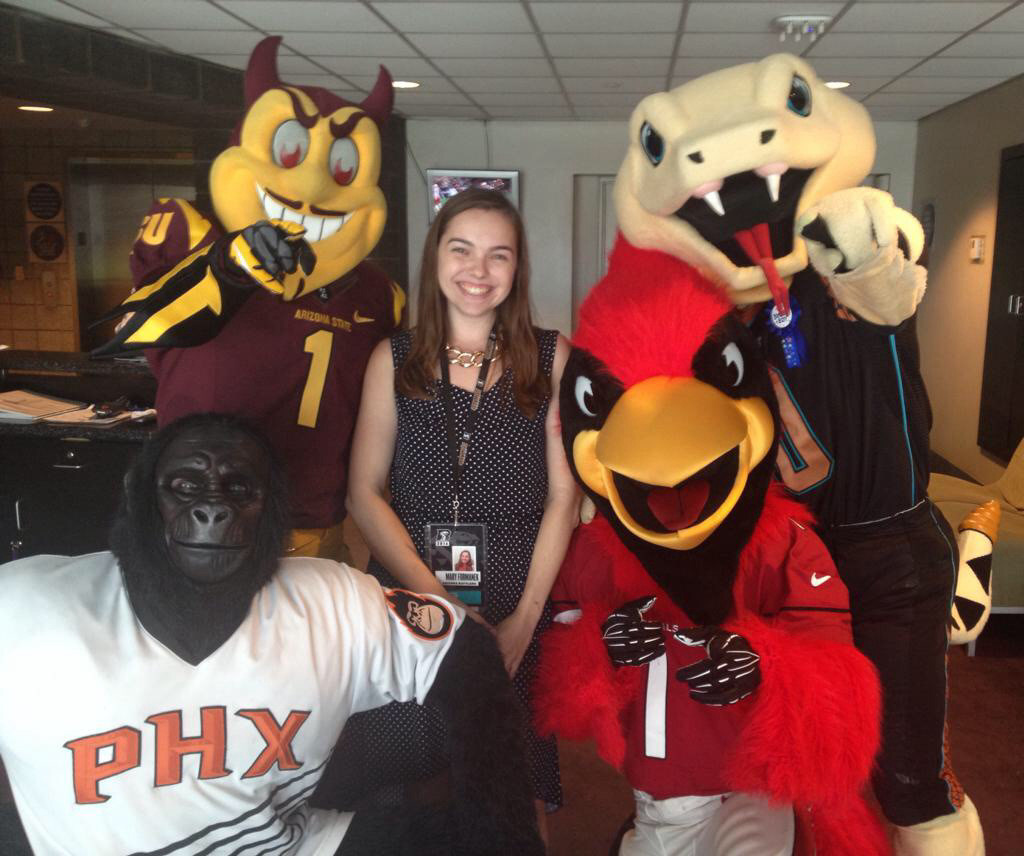 Mary with the local Arizona mascots. Mary was working as their VIP handler for the night during her internship with the Arizona Rattlers.